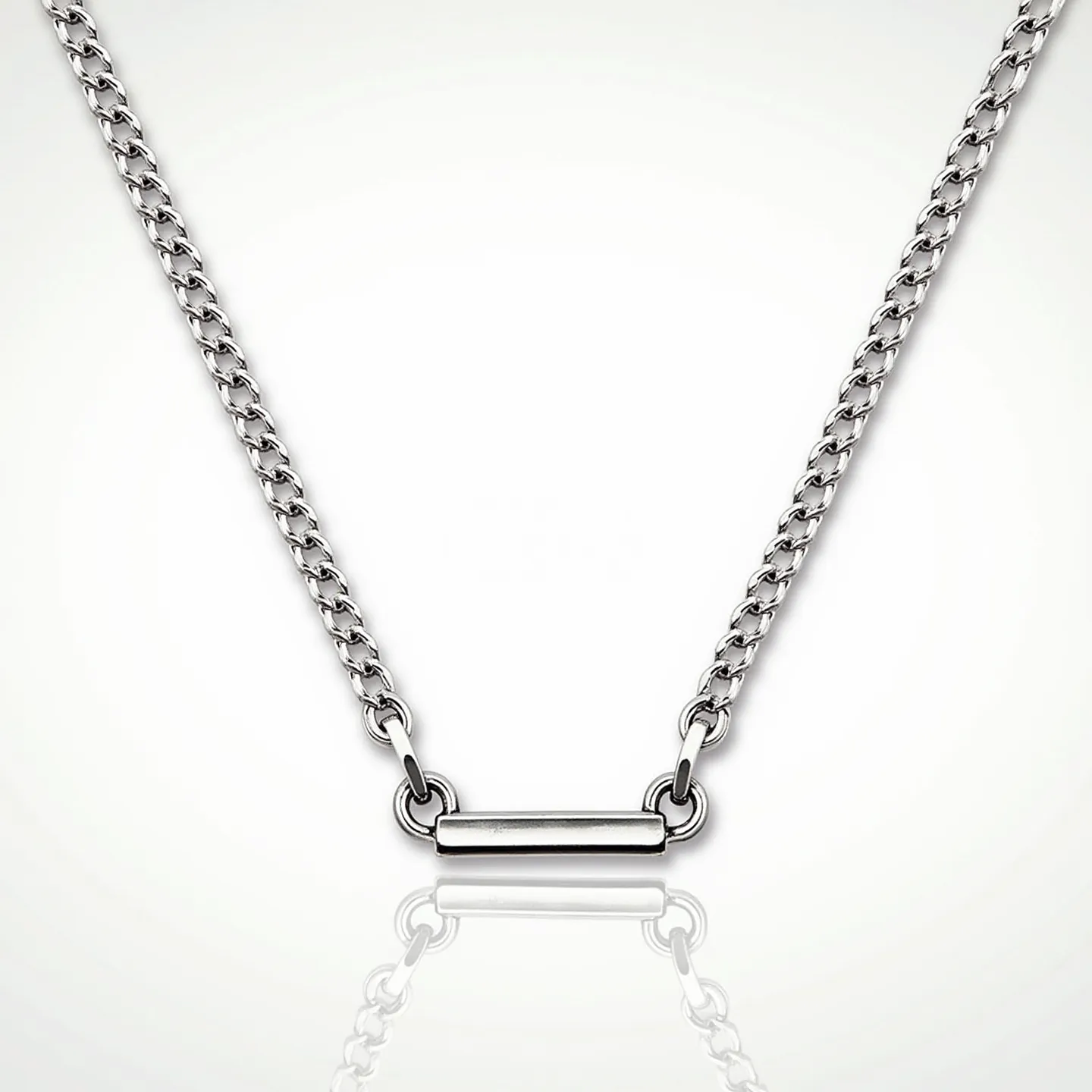 This boys chain necklace features a sleek, minimalist design with a polished silver metal chain, likely made of stainless steel or sterling silver. The links are uniform and tightly interlocked, giving the necklace a smooth, continuous appearance. At the center is a horizontal silver bar, adding a modern touch to the piece. The necklace is equipped with a simple, practical clasp, ensuring secure attachment around the neck. Its understated elegance makes it versatile for various occasions.