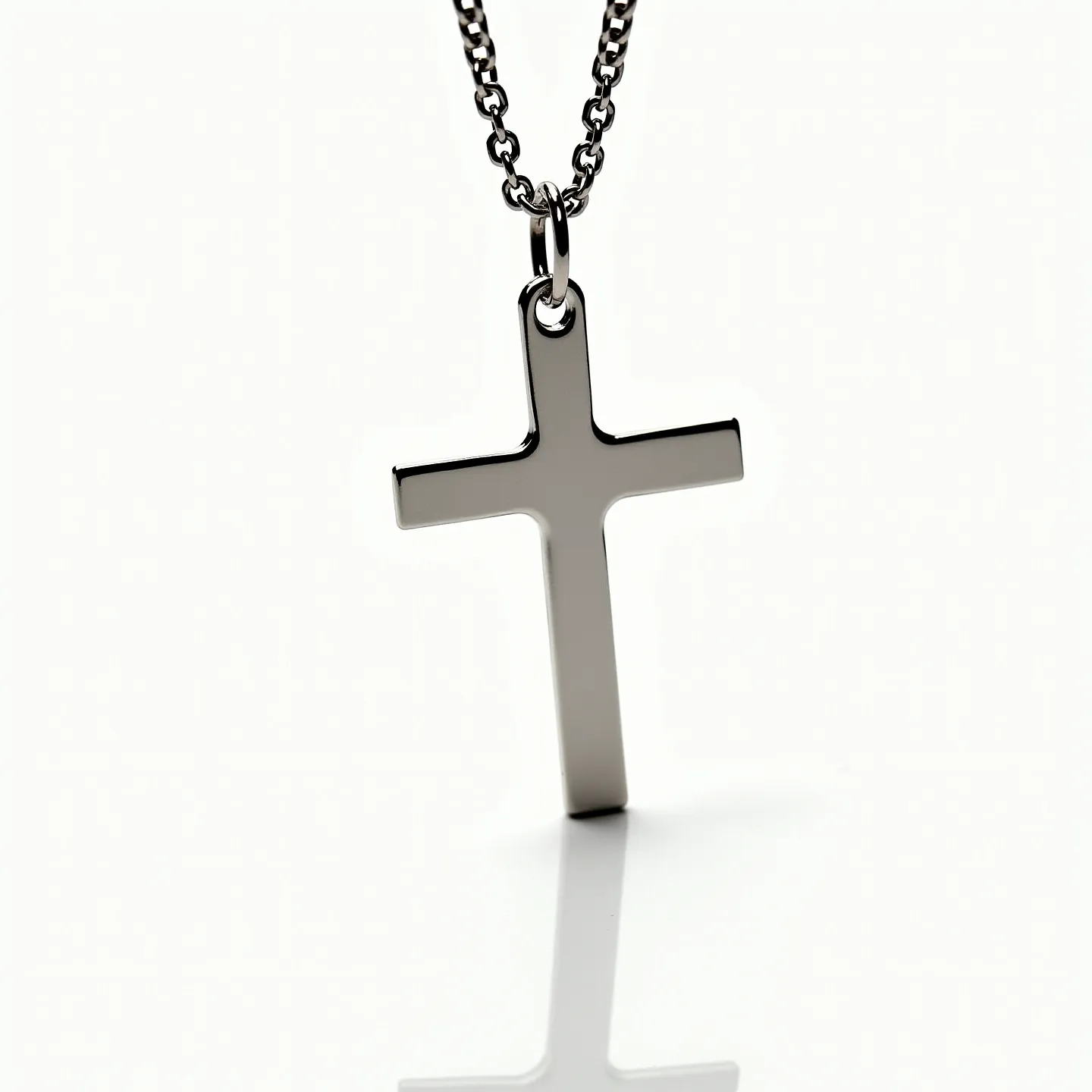 This boy's chain necklace features a sleek, polished metallic finish, likely made from a durable metal such as stainless steel or silver, providing a modern and elegant appearance. The chain is composed of interlocking links, giving it a classic, timeless design. Attached is a minimalistic cross pendant, which mirrors the chain's finish, adding a spiritual or symbolic element to the piece. The necklace includes a secure clasp, possibly a lobster clasp, ensuring it stays fastened during wear. This accessory combines simple design with meaningful elements, making it versatile for various occasions.