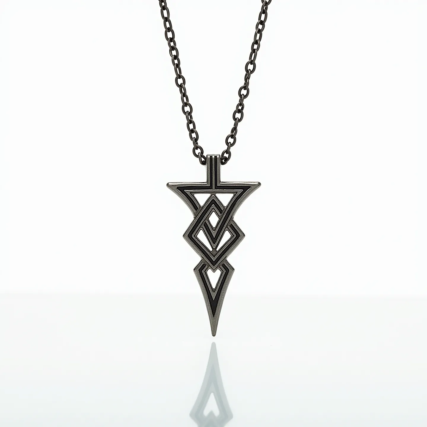 This boy's necklace features a chain made from a dark metallic material, likely stainless steel or a similar alloy, providing durability and a modern aesthetic. The pendant is an intricate geometric design that appears to be crafted from the same material as the chain, enhancing its cohesive, monochromatic look. The angular shapes within the pendant give it a contemporary and edgy feel. The chain links are evenly sized, contributing to a balanced and sturdy appearance. The necklace likely uses a standard clasp, possibly a lobster clasp, for secure attachment, although the specific type is not visible. Overall, the necklace is designed to be both stylish and versatile, suitable for various fashion expressions.