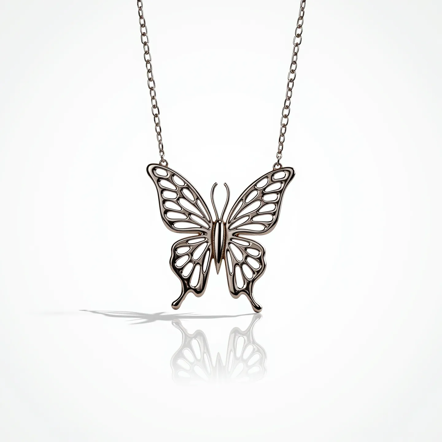 This butterfly necklace features a delicate design crafted from what appears to be a polished metal, likely silver or white gold, forming the intricate shape of a butterfly. The pendant showcases openwork detailing that mimics the delicate veining of butterfly wings, creating an airy and elegant appearance. The necklace is suspended from a slender chain that matches the material of the pendant, adding to the cohesive and refined look of the piece. The chain is connected to the butterfly through secure attachment points on either side of the wings, and it likely includes a clasp for fastening—common choices might include a lobster clasp or a spring ring clasp for reliable closure. The overall craftsmanship highlights attention to detail and a focus on elegance.