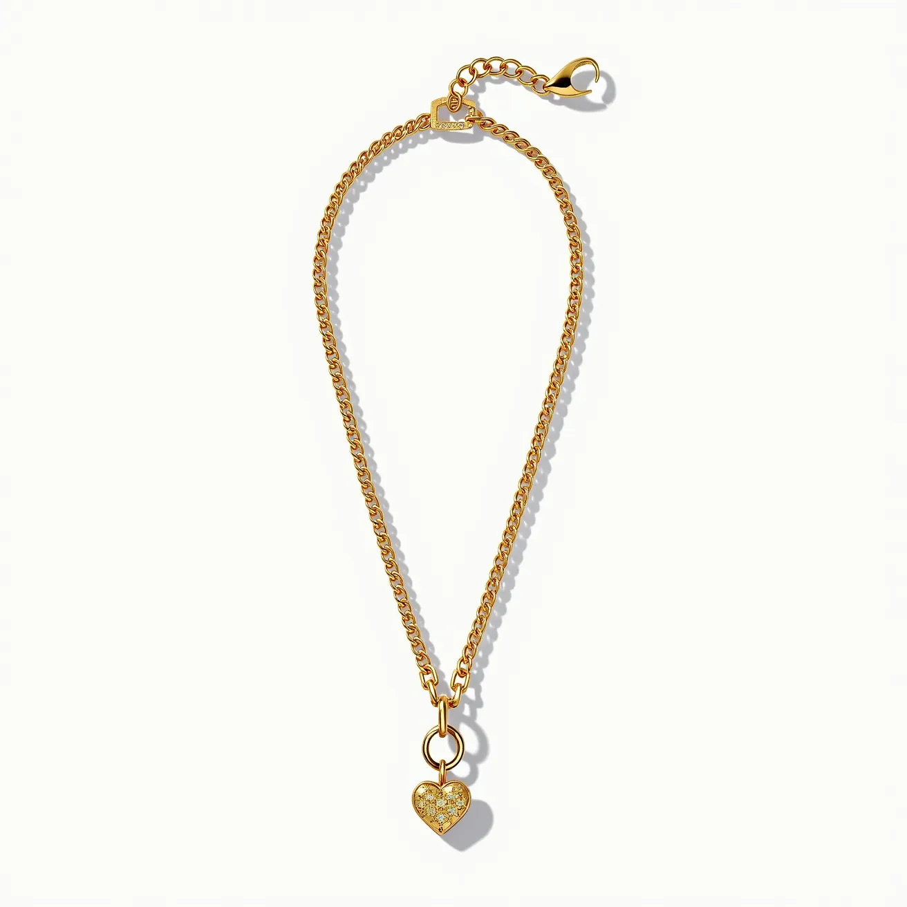 This cable chain features a classic, interlocking link design crafted from a polished yellow metal, likely gold or gold-plated. It is embellished with a heart-shaped pendant encrusted with multiple small, round-cut gemstones, possibly diamonds, set in a pavé style for a textured, sparkling effect. The chain is secured with a lobster clasp, providing a reliable and easy-to-use attachment mechanism. The chain also includes a short extender segment, allowing for adjustable length to suit different preferences.