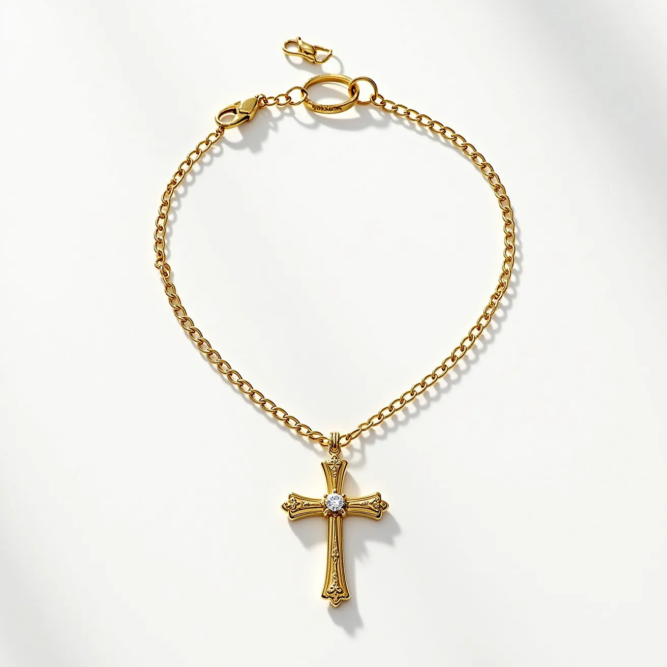 This catholic cross necklace is crafted from a gold-toned material, featuring a detailed and ornate design. At the center of the cross, there is a clear, round-cut gemstone set in a bezel setting, which adds a touch of elegance to the piece. The chain appears to be a slender, gold-toned cable chain, providing a delicate and understated look. For securing the necklace, there is a lobster clasp attachment, which is both practical and secure, complementing the design effectively.