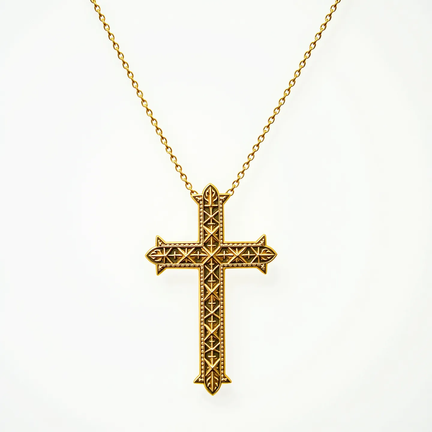 This catholic cross necklace features a gold-toned metal with intricate, embossed patterns on the cross, giving it an ornate appearance. The detailed designs across the surface contribute to its elaborate style, suggestive of craftsmanship and traditional symbolism. The necklace chain is simple and complements the pendant with its uniform links, ensuring focus remains on the cross itself. The necklace is likely secured with a standard clasp, providing both practicality and ease of wear.