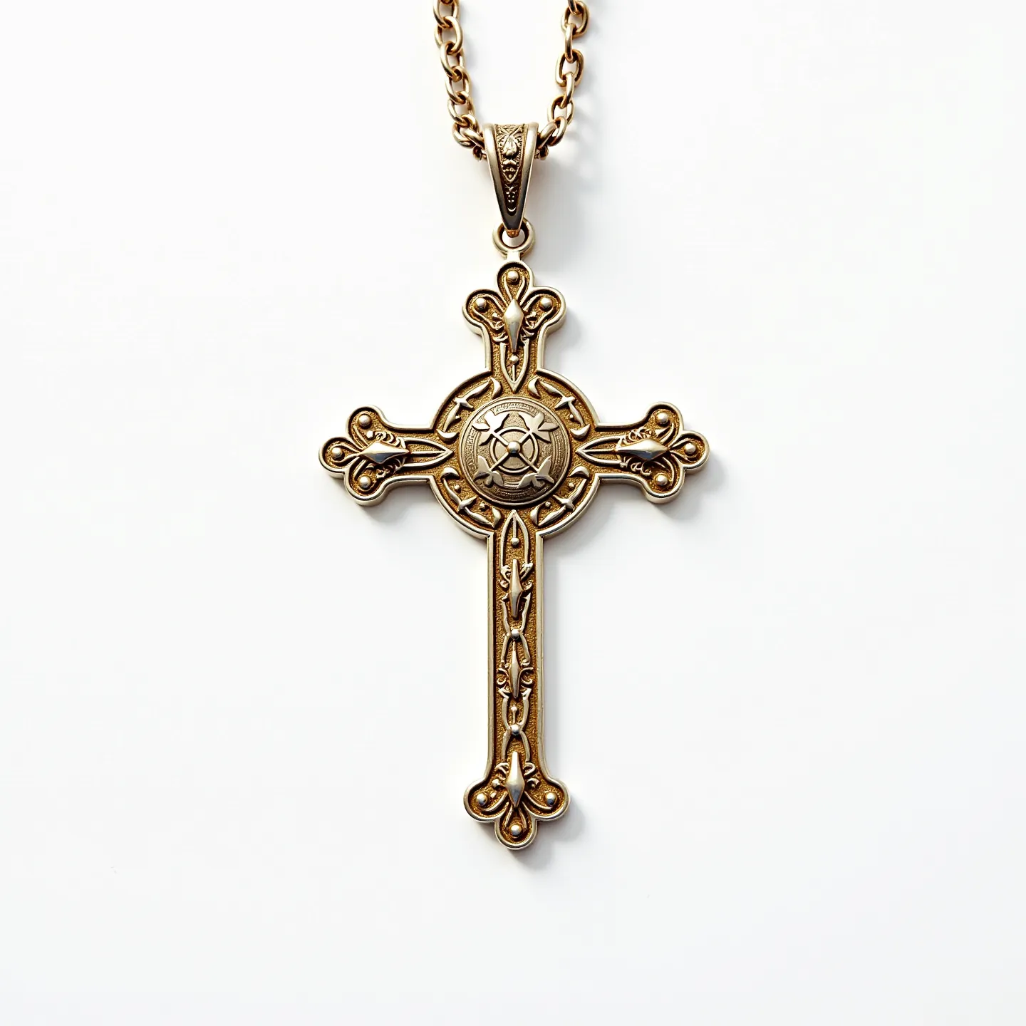 This catholic cross necklace features an ornate design crafted from a gold-toned metal that gives it an elegant and timeless appearance. The cross is adorned with intricate, embossed detailing that adds depth and character to its overall design. At the center of the cross, a circular emblem with a stylized motif provides a focal point, showcasing the craftsmanship involved. The cross hangs from a sturdy, twisted chain that complements the pendant's design without overpowering it. The attachment is secured with a decorative bail, offering a seamless connection between the chain and the pendant.