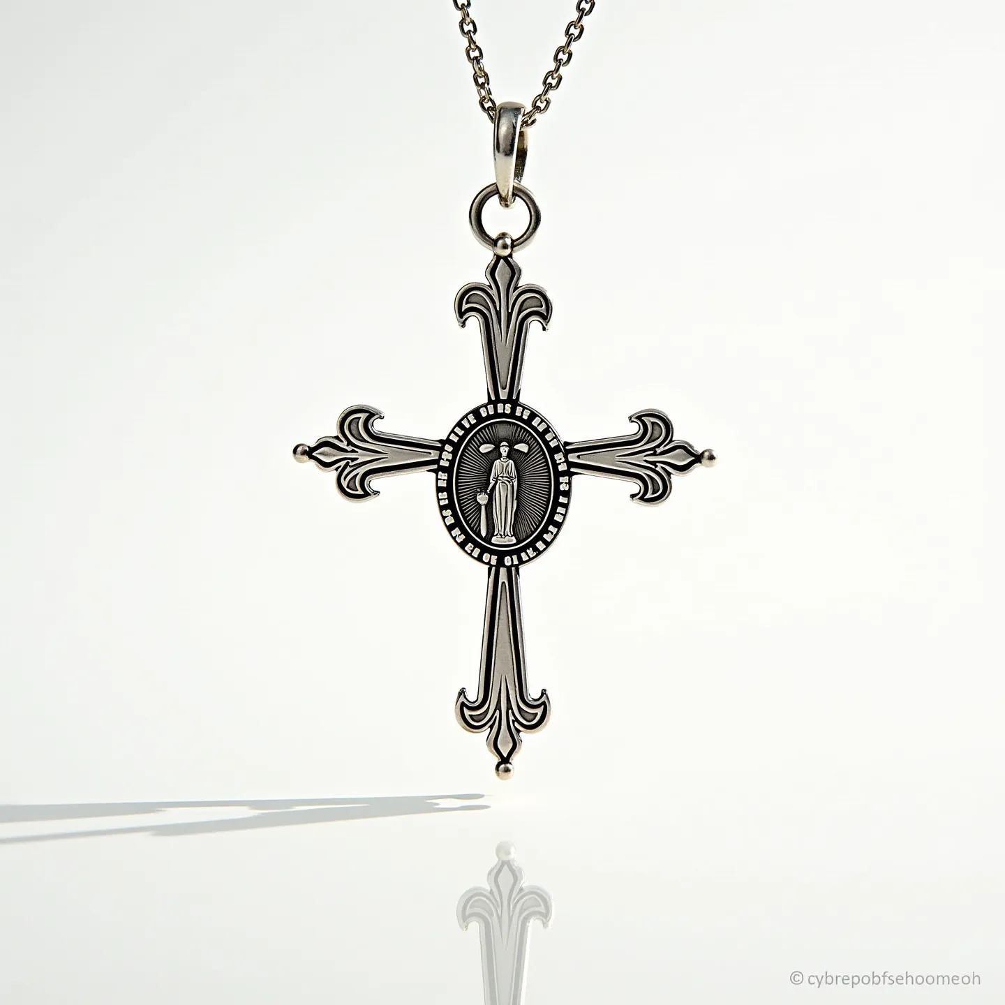 This Catholic necklace features an ornate cross pendant crafted from a silver-toned metal, showcasing intricate details and embellishments characteristic of religious iconography. In the center of the cross is an engraved medallion insert with a depiction of a saint, surrounded by inscribed text that adds to its spiritual significance. The cross has elegant, ornamental ends reminiscent of the fleur-de-lis design. It is attached to a chain via a circular bail and link, ensuring both durability and ease of wear. The chain itself is made of links that securely fasten with a clasp, making it both practical and aesthetically pleasing for daily wear or special religious occasions.