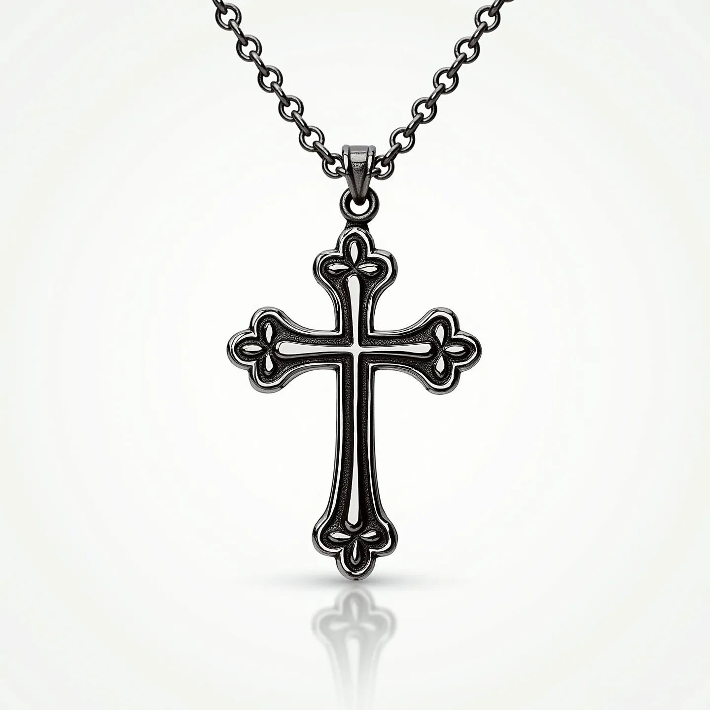 This catholic necklace features a classic cross design crafted from a metal with a dark, perhaps patina, finish, giving it an antique appearance. The cross exhibits intricate detailing at each end, suggestive of a Gothic or fleur-de-lis motif. The chain is comprised of uniform, oval links, providing a sturdy yet elegant structure that complements the pendant. The attachment appears to be a simple loop or bail affixed to the top of the cross, securing it to the chain seamlessly. There are no visible gemstones, emphasizing the metalwork's intricate design as the focal point of the piece.