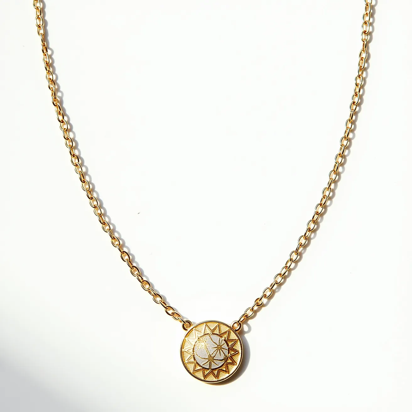 This chain link necklace features a delicate design crafted from what appears to be a gold-hued metal, forming rounded links that elegantly drape around the neck. At its center, the necklace showcases a circular pendant with an intricate sunburst design, offering a captivating focal point. The pendant is framed within an embossed gold rim, adding depth and texture. The clasp appears to be a standard spring ring, providing a secure and classic attachment.