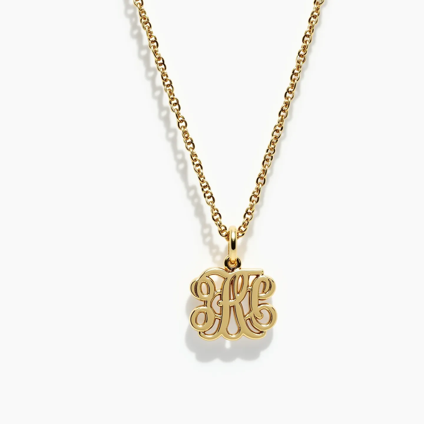 This charm necklace gold features a beautifully crafted pendant with intricate script detailing, likely made from polished gold, giving it a luxurious and elegant appearance. The pendant is attached to a delicate gold chain that complements its design, likely made from a similar gold material to ensure a cohesive look. The chain appears to be a classic cable chain, which is not only stylish but also durable. The necklace likely includes a standard spring ring clasp, providing a secure and easy-to-use attachment for everyday wear. This charming and sophisticated necklace would be a fitting accessory for various occasions.