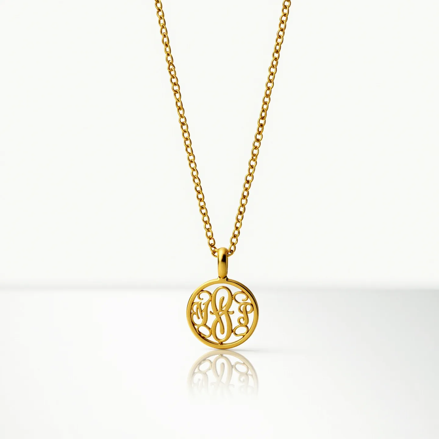 This charm necklace gold features an intricately designed circular pendant with ornate, interwoven initials or script in a polished gold finish. The pendant is suspended from a delicate gold chain that enhances its elegance. The necklace employs a classic link design, providing both durability and a refined aesthetic. The charm and chain are made entirely of gold, conveying a sense of luxury and sophistication. The attachment of the charm to the chain is seamless, demonstrating careful craftsmanship and attention to detail.