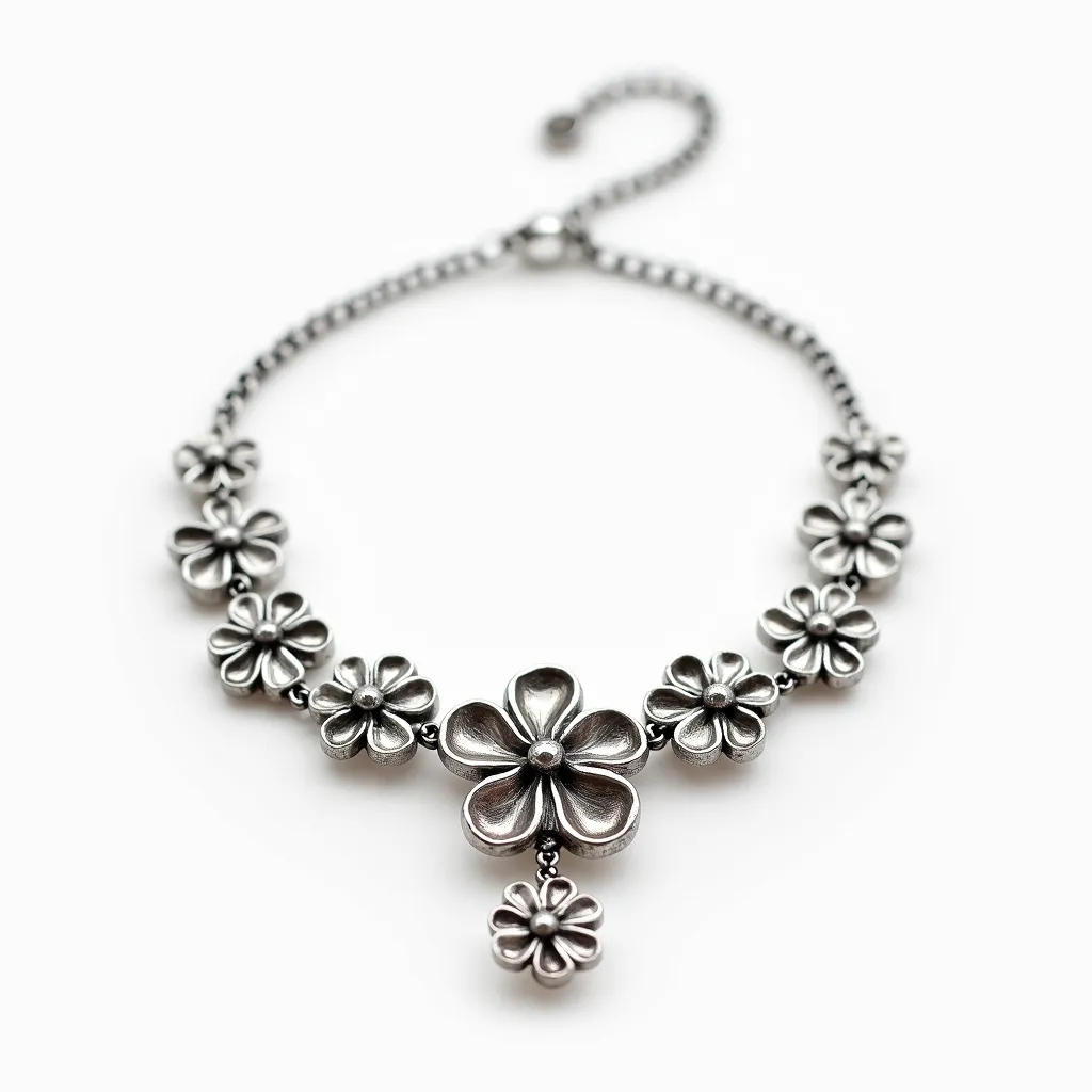 This elegant choker necklace features a series of intricately crafted floral motifs, each flower endowed with delicate petal details, giving the piece a refined and artistic elegance. It appears to be composed of a metallic material, likely silver, which adds a lustrous and timeless appeal to the design. At the center, a prominent flower adds emphasis, while smaller floral elements are symmetrically arranged along the length of the necklace. This central flower is accentuated with a small dangling flower, enhancing its graceful aesthetic. The necklace is secured with a classic hook-and-loop clasp, allowing for seamless wear while ensuring it stays secure. The overall craftsmanship reflects an exquisite balance between simplicity and sophistication.