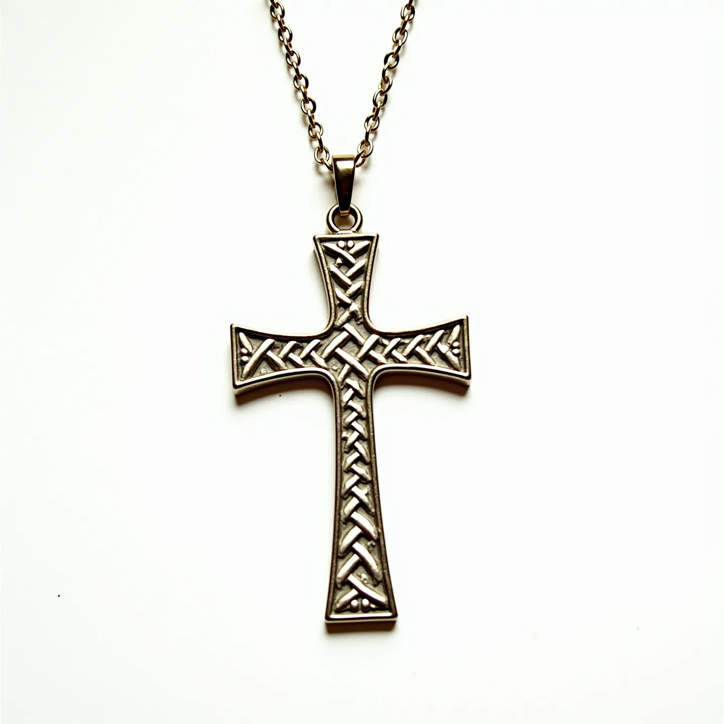 This cross necklace features a pendant crafted from metal with an intricate, braided design that evokes a sense of elegance and durability. The chain consists of round, interlocking links that contribute to the overall vintage aesthetic. The pendant is attached to the chain with a sturdy bail, ensuring secure wear. The chain appears to be equipped with a clasp suitable for easy opening and closing, providing functionality alongside its decorative appeal. Overall, the combination of materials and design elements create a timeless piece suitable for various occasions.