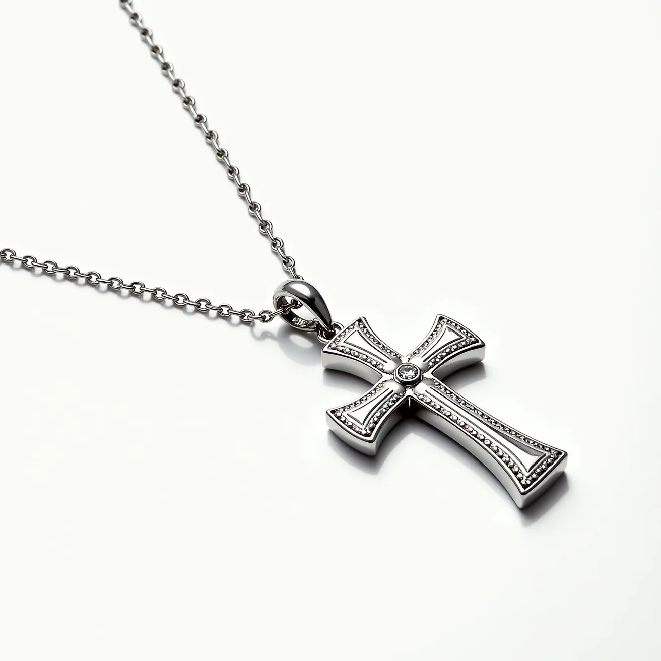 This cross necklace features a robust and polished chain crafted from a silver-toned metal, lending it a refined and modern aesthetic. The pendant is a stylish cross with detailed edges, highlighting craftsmanship and precision. At the center of the cross, a small, round-cut gemstone, possibly a diamond or cubic zirconia, is carefully set, adding a subtle sparkle that enhances the overall elegance. The pendant hangs from a decorative, integrated bail that seamlessly connects to the chain, ensuring a secure attachment. The necklace likely closes with a conventional clasp, making it easy to wear and remove.