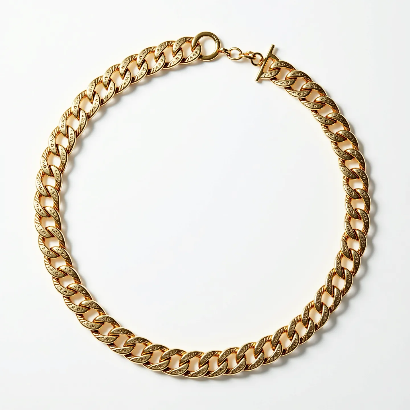 This Cuban link chain is crafted from a lustrous gold material, presenting a series of interlocking links that create a sturdy and elegant design. Each link is substantial in size, reflecting the classic Cuban style known for its bold appearance. The chain is equipped with a toggle clasp, which adds a touch of vintage style and secures the chain effectively. The smooth surface of the links enhances the chain's reflective qualities, emphasizing its luxurious finish.