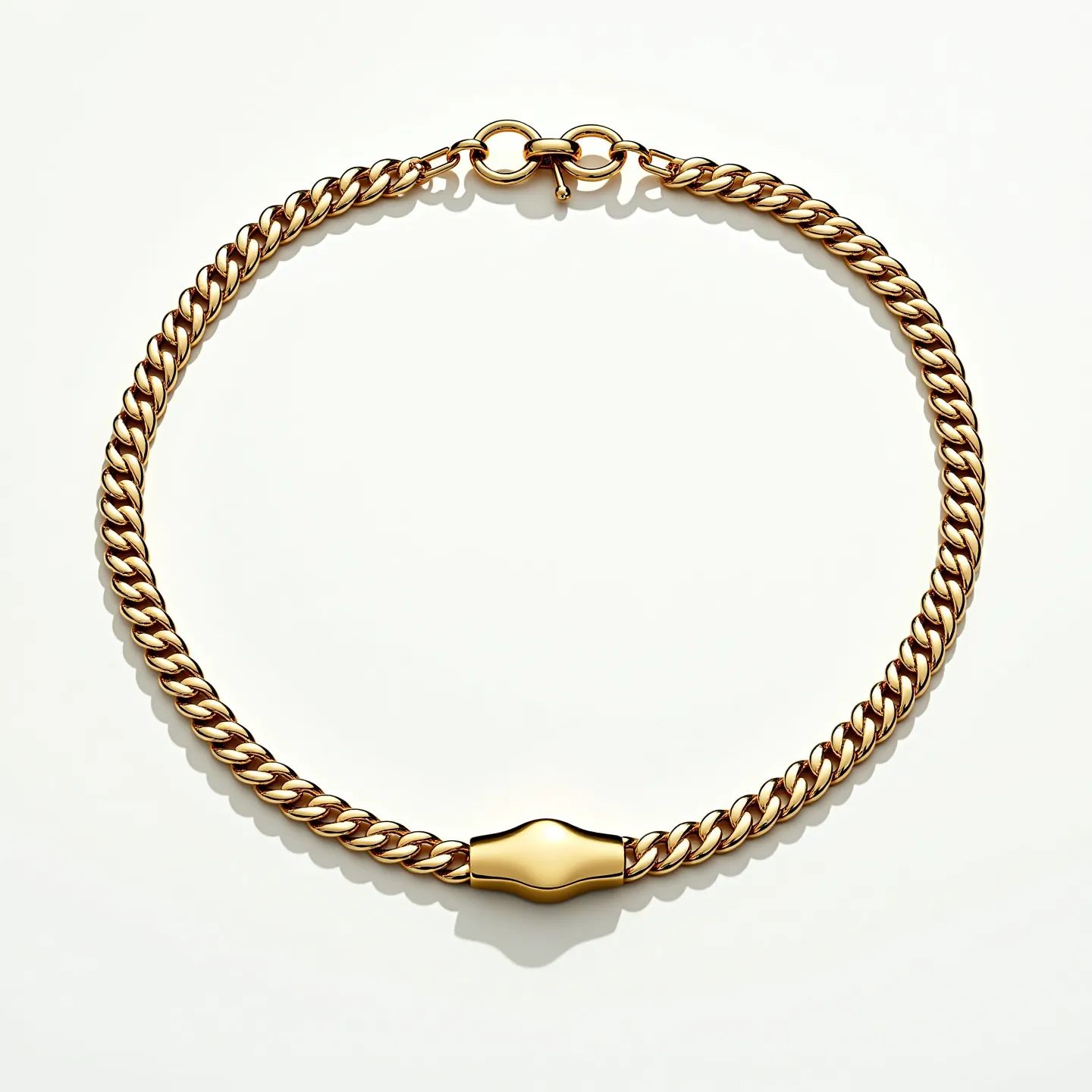 This Cuban link chain is crafted from a gold-toned metal, featuring a series of interlocking links that create a classic and robust design. At the center, there is a smooth, solid gold-tone segment that accentuates the chain's luxurious appearance. The piece is secured with an elegant clasp mechanism, which includes a round element leading into a toggle-style fastener, ensuring a secure and stylish closure. The overall design is sleek and timeless, highlighting both durability and elegance.