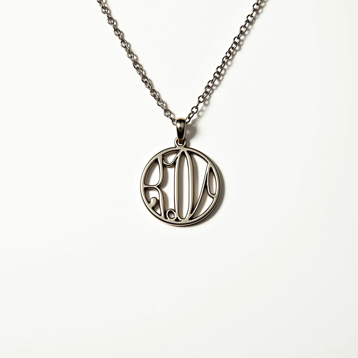 This custom charm necklace features a circular pendant with intricate monogram-style lettering crafted from a metal, likely stainless steel or sterling silver, giving it a sleek and polished appearance. The pendant is suspended from a matching metal chain that is composed of evenly sized links, providing both strength and a classic aesthetic. The attachment includes a standard metal bail that connects the pendant to the chain securely. The necklace does not appear to contain any gemstones, maintaining a minimalist yet elegant design suitable for everyday wear.