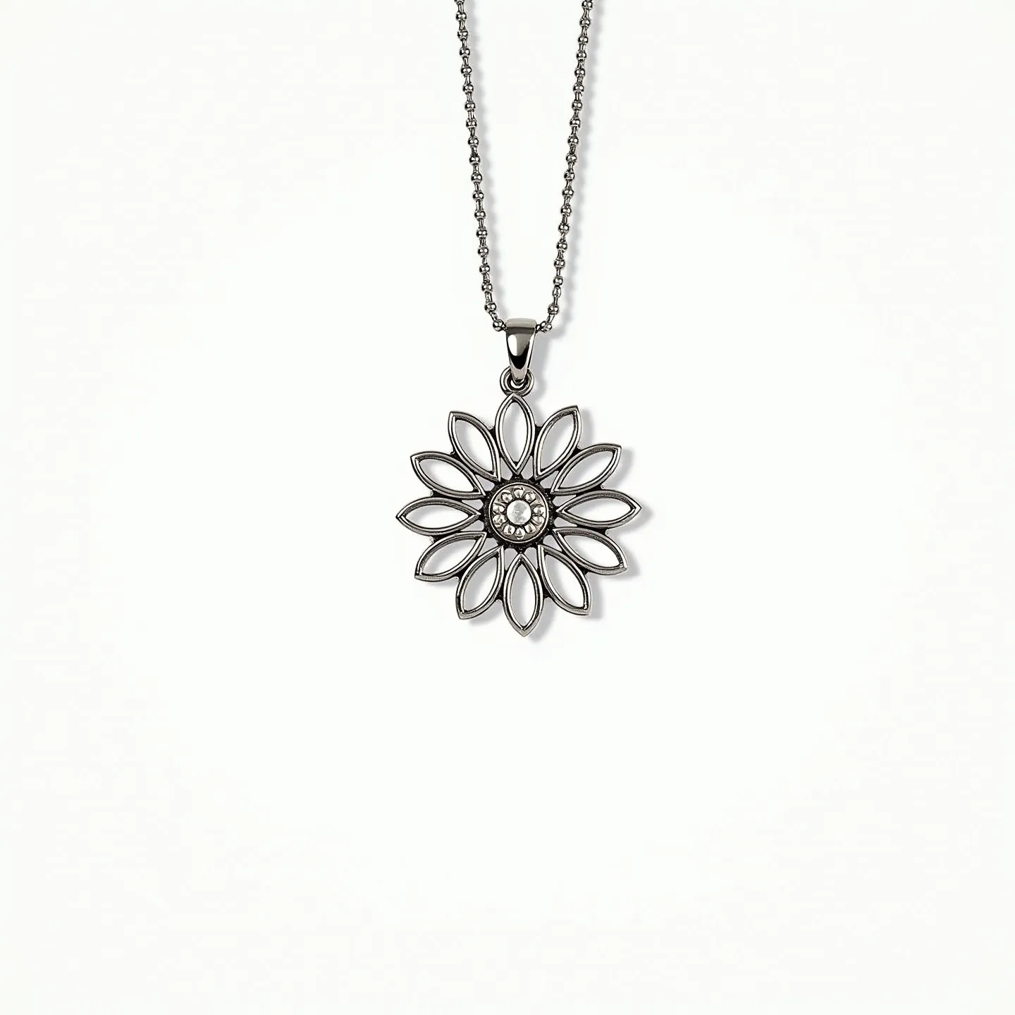 This daisy necklace features a delicate pendant shaped like a daisy with open petal designs. The petals are crafted from a shiny metal, possibly sterling silver or stainless steel, providing a sleek and modern appearance. At the center of the pendant is a round gem, likely a small, cut crystal or cubic zirconia, set in a bezel setting that adds a touch of sparkle. The pendant is attached to a fine chain with a lobster clasp, ensuring a secure closure. The overall design is elegant and versatile, suitable for various occasions.