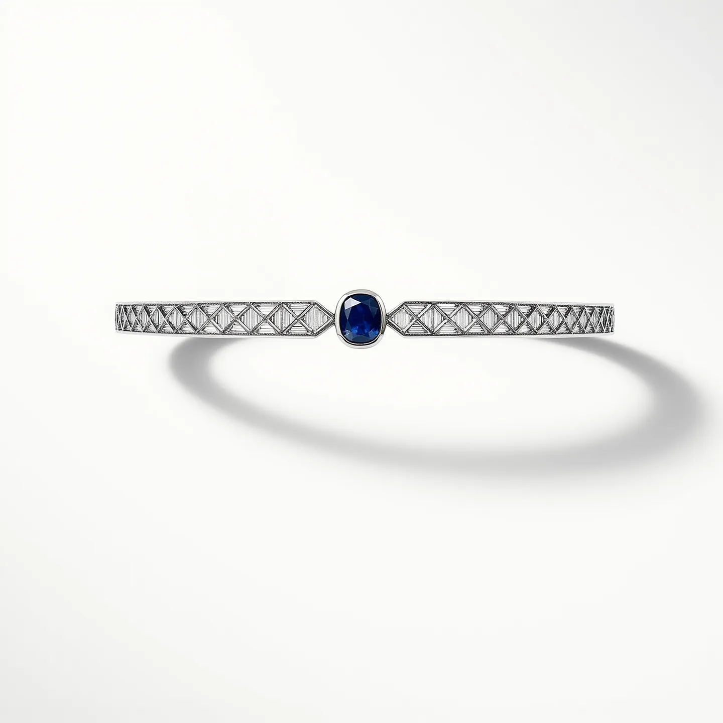 This diamond choker necklace features a sophisticated design with a prominent blue gemstone at its center, likely a sapphire, which appears to be cushion-cut and set in a bezel setting. The choker is crafted from a precious metal, possibly platinum or white gold, and is adorned with a linear arrangement of small, round-cut diamonds in a lattice pattern. The diamonds are set in individual prong settings, enhancing their brilliance and contributing to the necklace's elegant appearance. The overall construction suggests a seamless and secure fit, likely incorporating a hidden clasp or an integrated fastening mechanism that maintains the necklace's streamlined aesthetic.