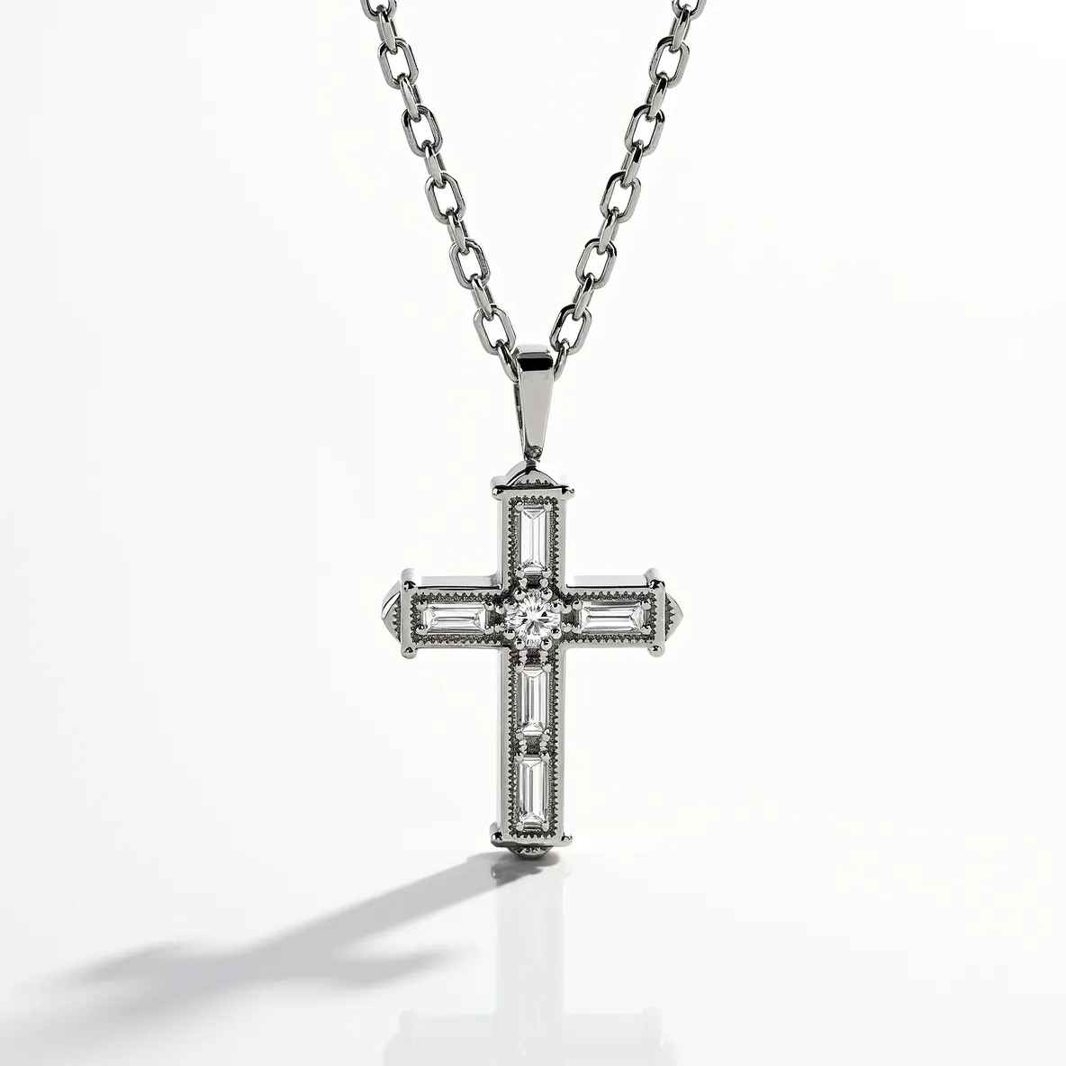 This diamond cross necklace features a finely crafted cross adorned with a central round-cut diamond, surrounded by baguette-cut diamonds set in a sleek metal framework. The metal, likely white gold or platinum, provides a luminous backdrop to the sparkling gemstones, enhancing their brilliance. The necklace chain is composed of interlinked rectangular links, offering both a contemporary and timeless aesthetic. The cross is securely attached to the chain via a sturdy bail, ensuring it hangs elegantly.