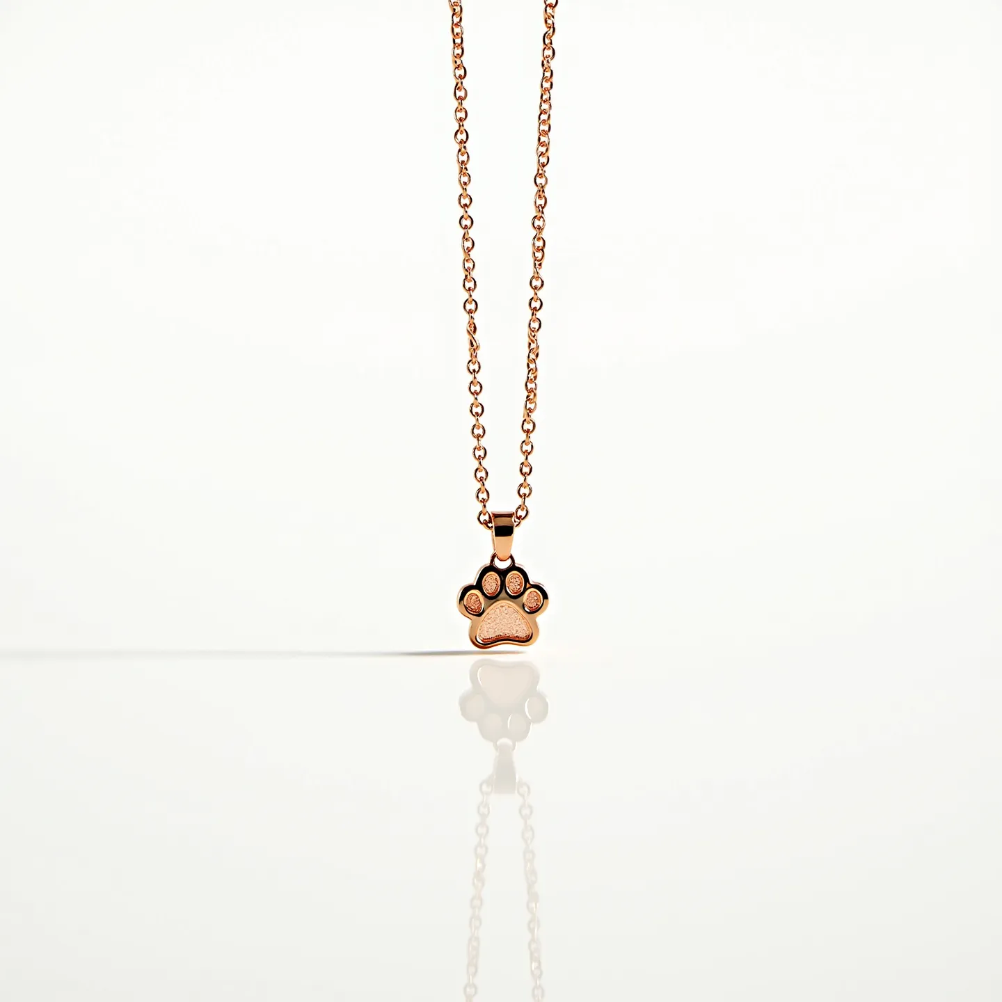 This dog necklace features a paw-shaped pendant crafted from a shiny metallic material with a warm, golden hue. The design includes small, round stones embedded at the tips of each toe, possibly set using a bezel or prong setting for security and added sparkle. Each stone has a similar cut, contributing to the overall symmetry and allure of the piece. The chain is composed of interlinked circular links, offering both flexibility and durability, typical of designs meant for regular wear. Additionally, it is equipped with a standard clasp mechanism that ensures the piece is securely fastened when worn. This necklace combines elegant and playful elements, making it an appealing accessory for dog enthusiasts.