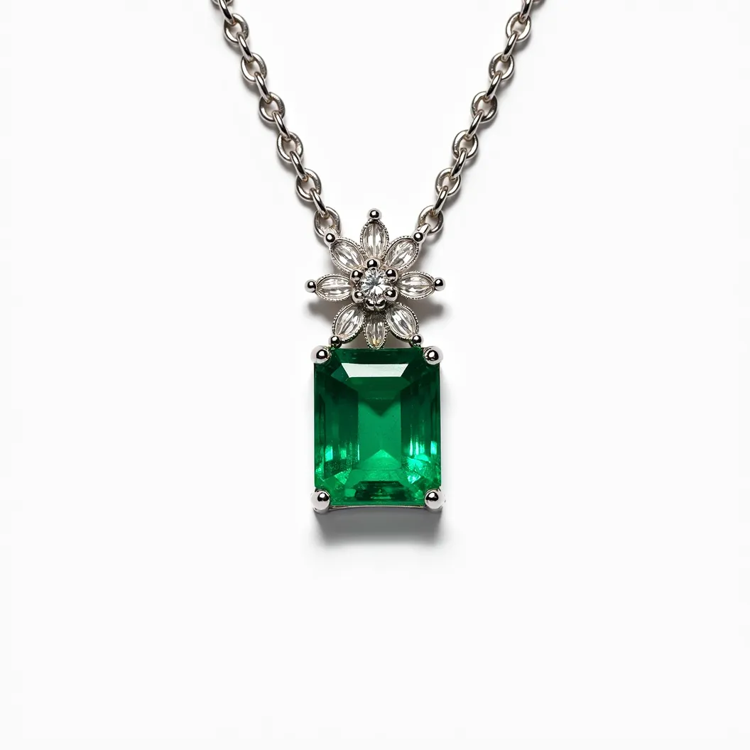 This emerald necklace features a prominent, rectangular-cut emerald gemstone, set in a classic prong setting that highlights its deep green hue. The pendant is adorned with a floral motif composed of smaller, marquise and round-cut diamonds, adding a touch of sparkle and elegance. The chain is crafted from a lustrous metal, likely white gold or platinum, which complements the vivid colors of the gemstones. The necklace is secured with a sturdy yet refined clasp that ensures both security and seamless design integration.