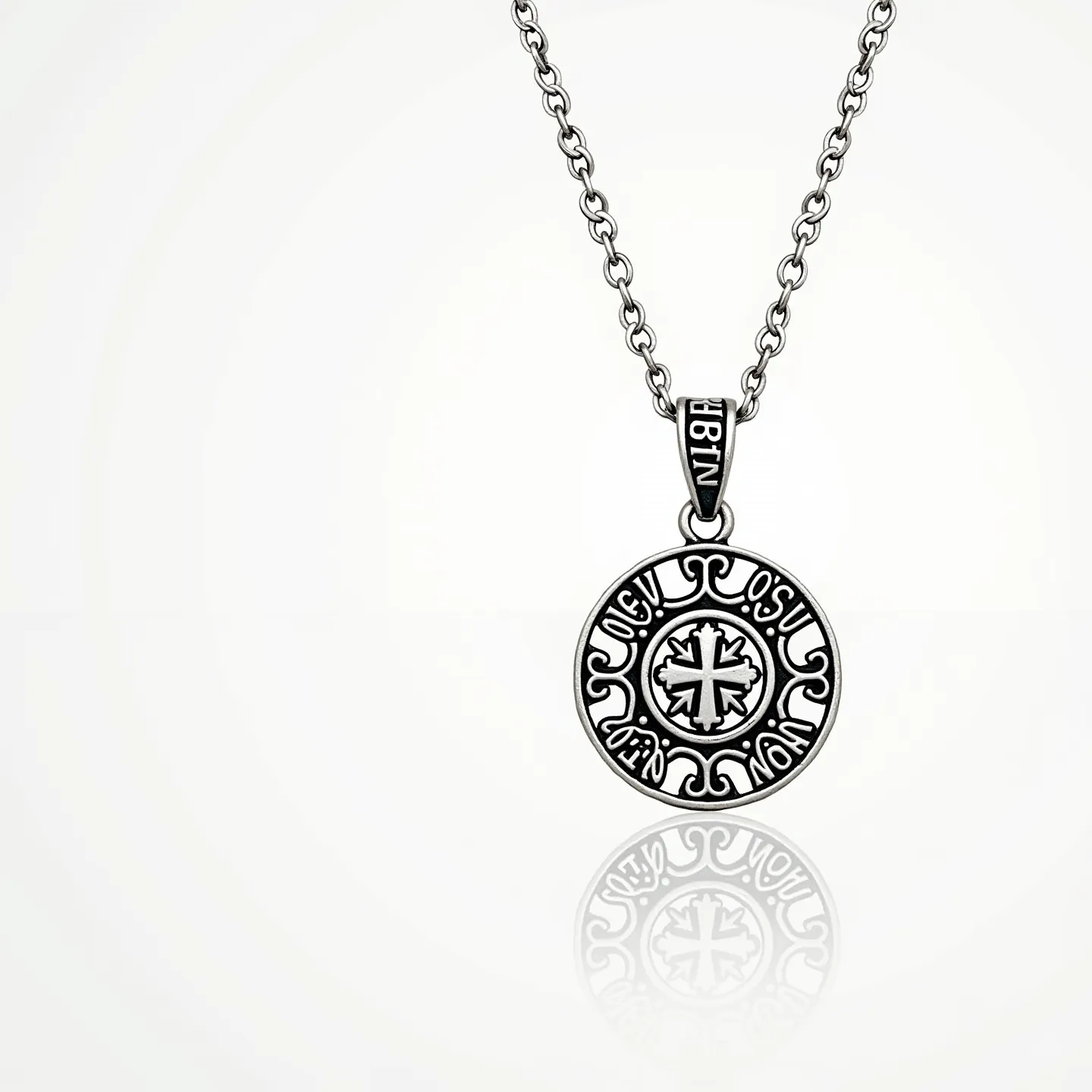 This faith necklace features an intricate round pendant crafted from silver-toned metal with elegant engravings that incorporate a central cross motif. The pendant is suspended from a matching chain made from oval links, highlighting the continuity of the design. The articulations on the pendant present a blend of ornate and spiritual symbols, adding to its thematic significance. The necklace likely closes with a discreet clasp, ensuring a secure and comfortable fit. This piece embodies both religious symbolism and refined artistry, suitable for both everyday wear and special occasions.