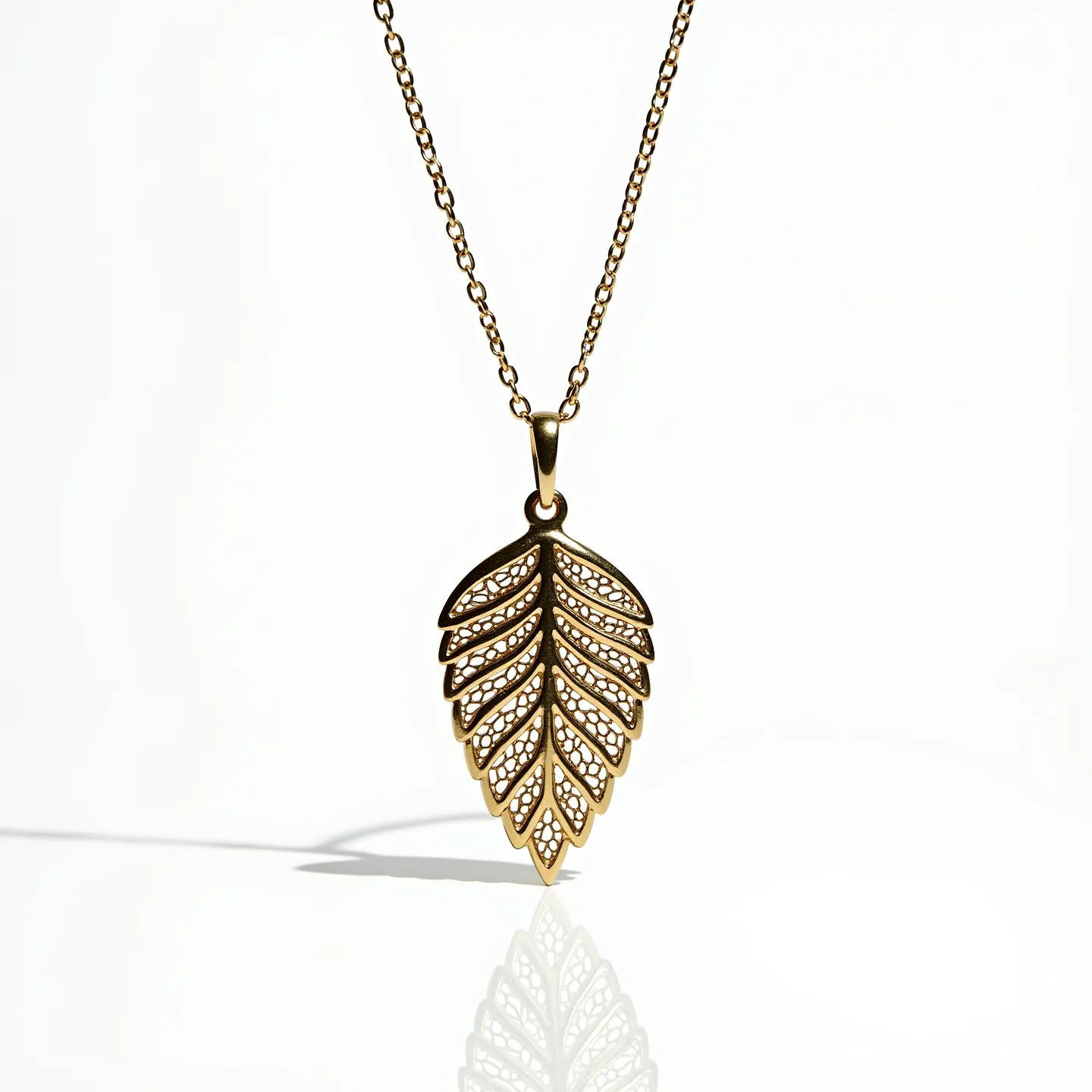 This flower necklace features a pendant designed in the shape of an intricate leaf, crafted from a metallic material with a gold-tone finish. The pendant has a delicate openwork pattern, which adds elegance and highlights the detailed craftsmanship. It hangs on a fine chain, likely made of a similar material for a cohesive look, fastened with small, unobtrusive links. The attachment appears to be a simple bail that seamlessly connects the pendant to the chain. The chain likely includes a standard clasp, providing ease of wear while ensuring security.