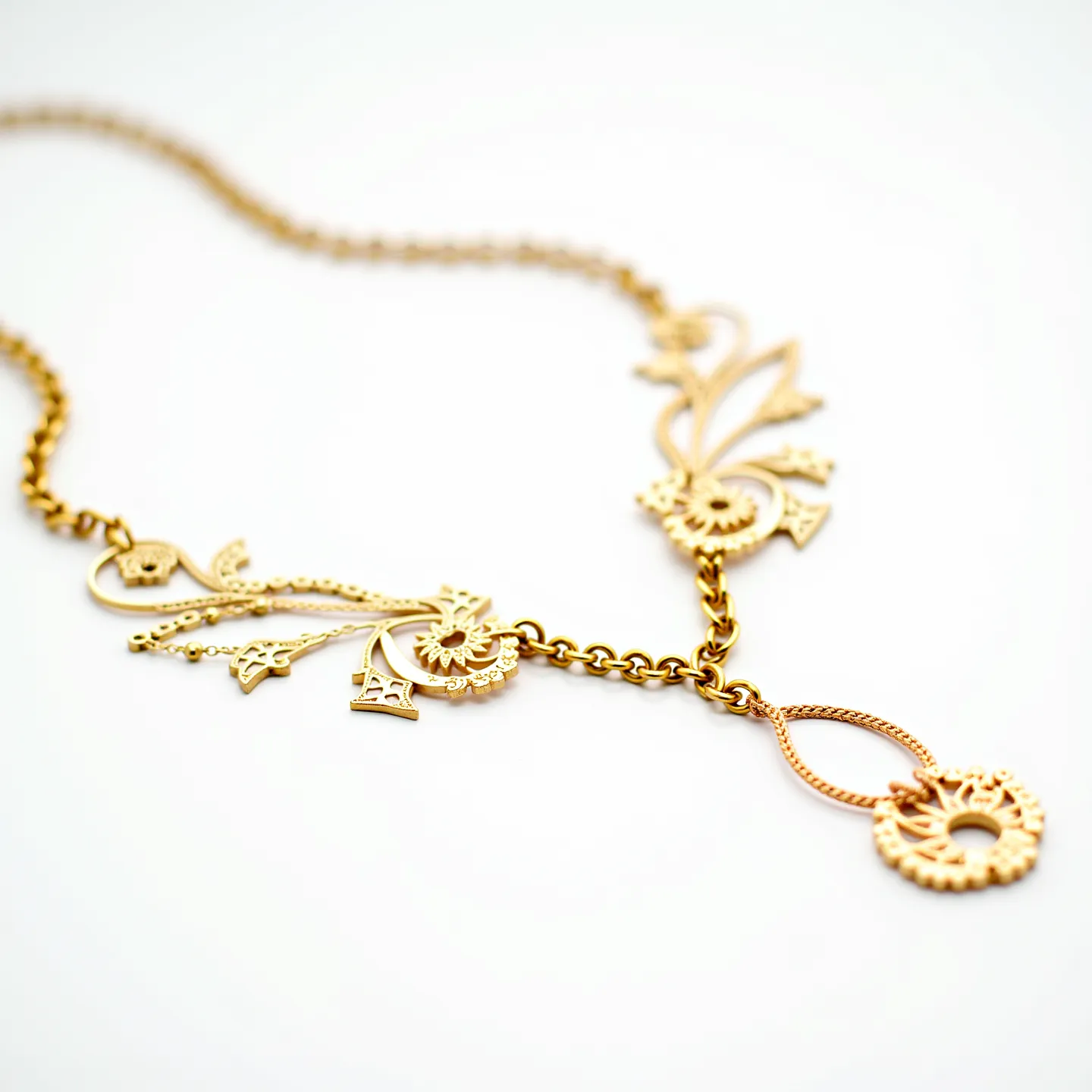 This girl's necklace features an intricate design crafted primarily from gold, showcasing a delicate and decorative motif. The piece includes a series of ornate elements connected by a fine gold chain. The ends of the chain appear to be linked to a decorative pendant characterized by filigree detailing and artistic flourishes, resembling floral or abstract shapes. The necklace’s clasp or attachment isn't visible, suggesting it might be hidden or seamlessly integrated into the design. The piece reflects a balance between elegance and craftsmanship, suitable for both formal and casual wear.