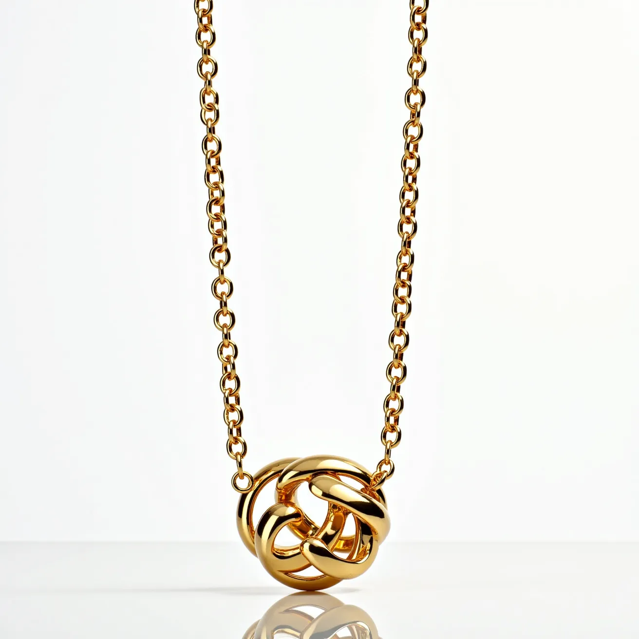 This gold chain features a classic and elegant design composed of evenly interlinked round links, providing a smooth and continuous appearance. At the center hangs a bold, gold knot pendant that is intricately intertwined, adding a sophisticated focal point to the piece. The chain appears to be made of polished gold, enhancing its shine and luxurious appeal. The pendant acts as a feature piece, drawing attention without any additional gems or stones, emphasizing the beauty of the gold itself. The chain's ends are secured by a typical clasp mechanism, ensuring a secure and easy-to-use attachment.