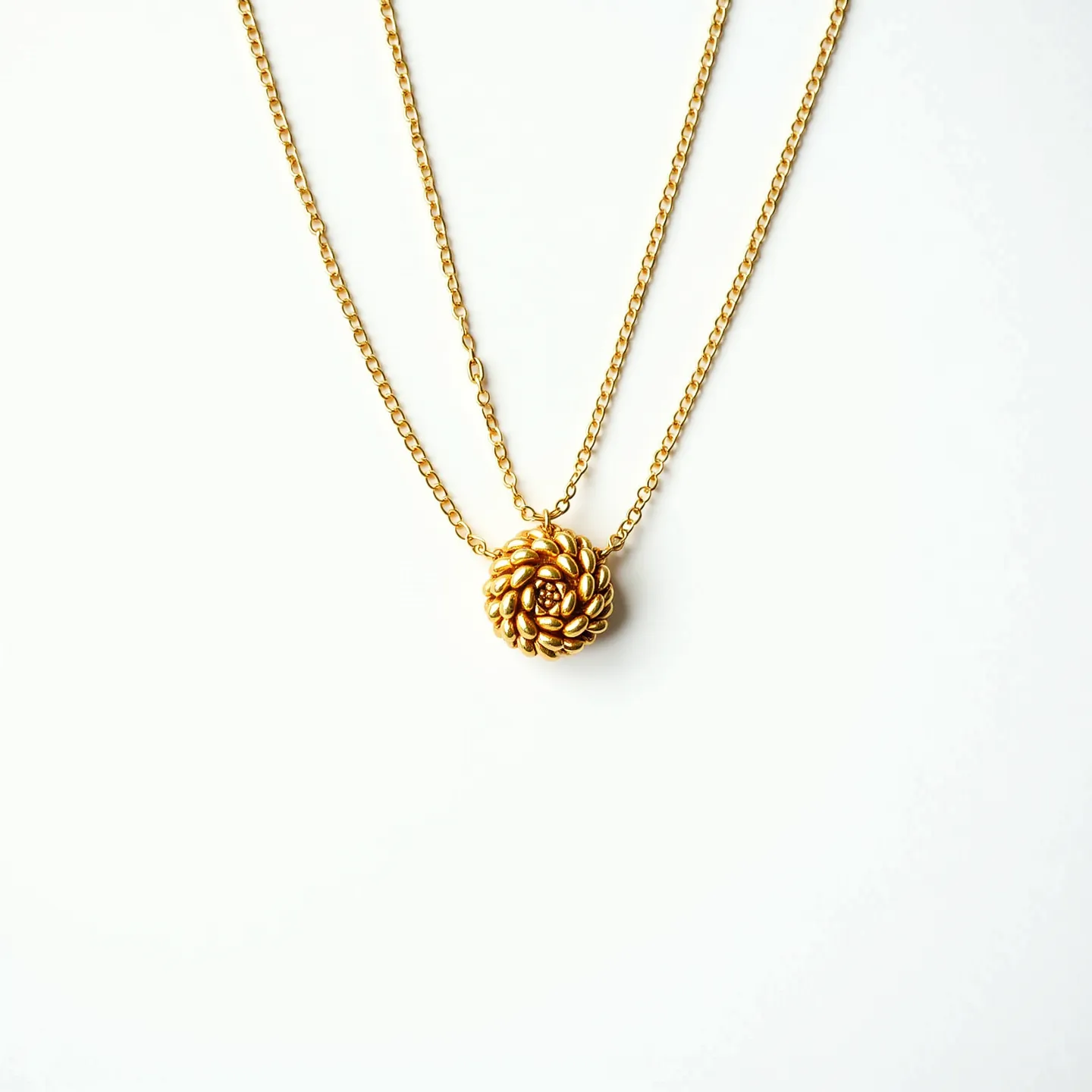 This gold chain necklace features a delicate dual-chain design, crafted from a lustrous golden material. At its center, it showcases an intricately woven gold pendant, resembling a floral or knotted motif. The pendant is carefully crafted, demonstrating a seamless flow and symmetry within its design. The necklace appears to be finished with a secure clasp, typical of refined jewelry pieces. The radiant sheen of the gold enhances its elegance and makes it a versatile accessory suitable for various occasions.