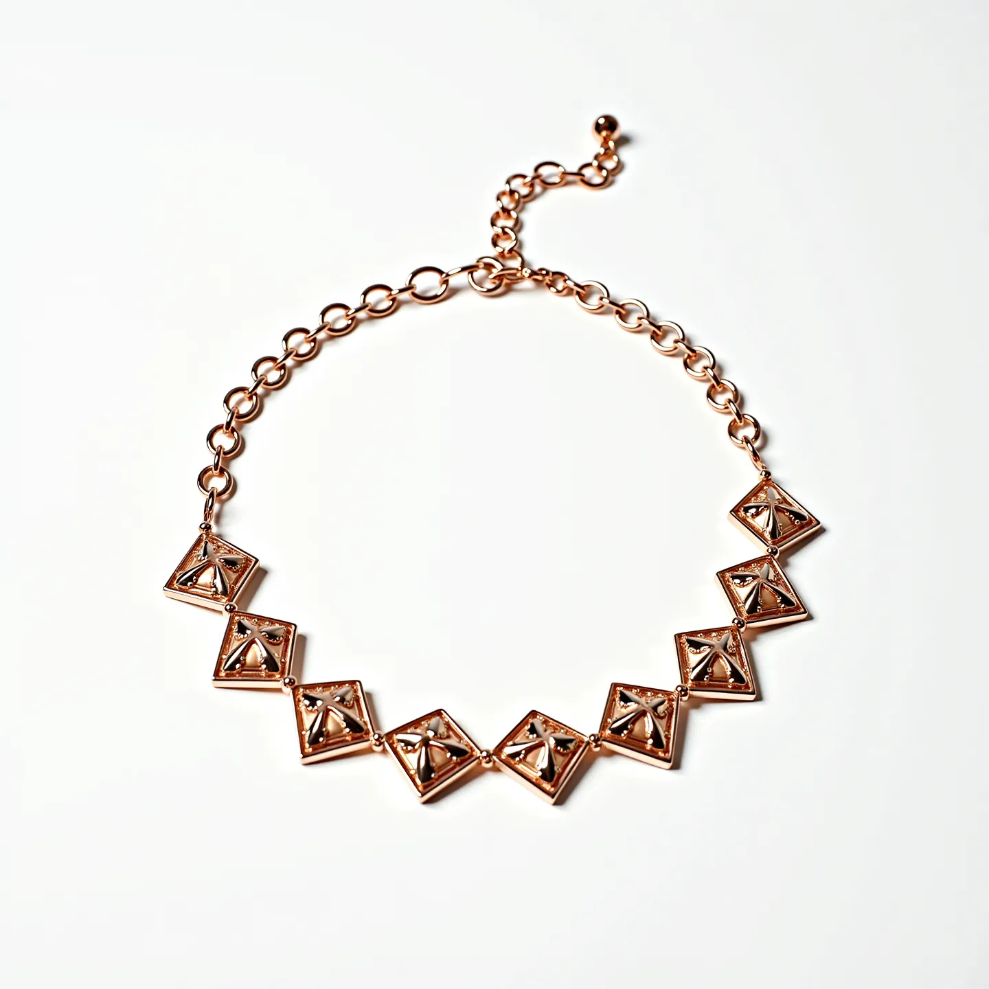 This gold choker necklace features a series of linked geometric gold elements, each designed in a diamond-shaped pattern that is both modern and elegant. The gold appears polished, giving the necklace a luxurious shine. Each geometric piece is intricately set with pyramid-shaped studs, contributing to its unique texture and appeal. The necklace is fastened with an adjustable gold chain clasp, allowing for versatile sizing and a secure fit. Overall, the combination of the gold material and distinctive shape of the elements makes this necklace a striking accessory.