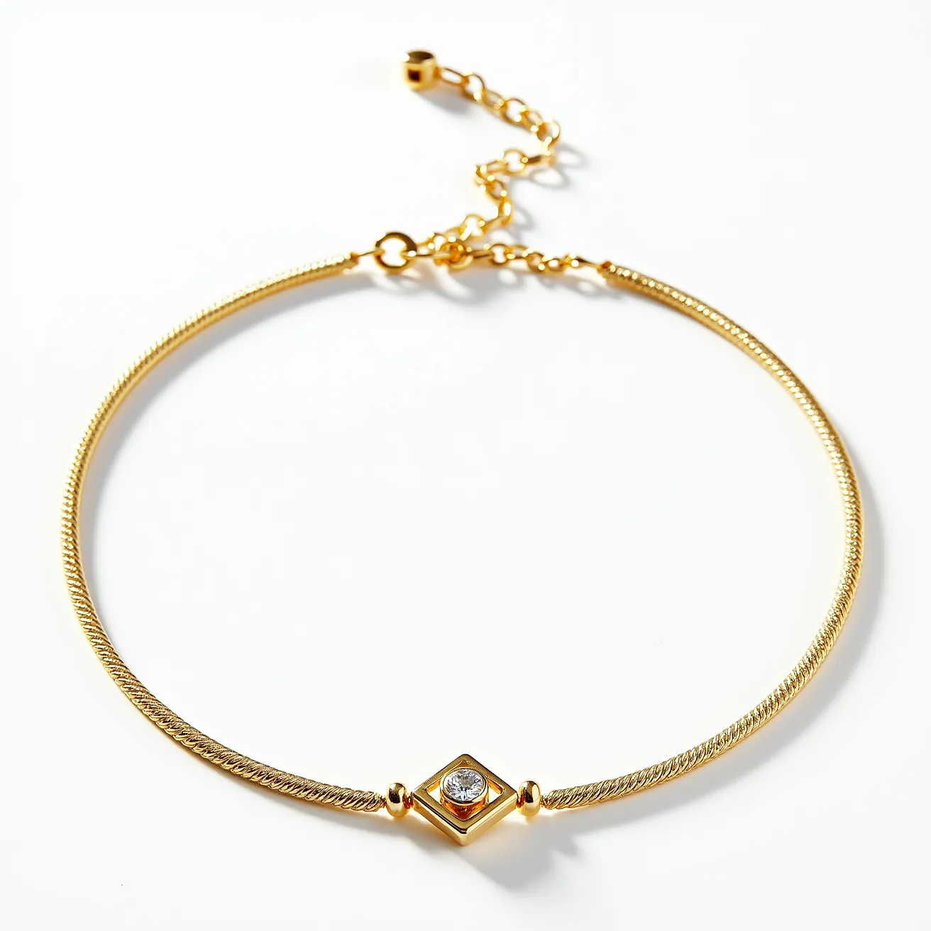 This gold choker necklace features a sleek and elegant design, composed primarily of a gold chain that forms a close-fitting band around the neck. At the center, there is a single, bezel-set gemstone, possibly a diamond, which adds a touch of sparkle and sophistication. The stone is round cut, enhancing its brilliance and clarity. The necklace has a secure clasp, which is an adjustable lobster clasp with an extension chain, allowing for slight modifications in length to ensure a comfortable fit. The overall craftsmanship exhibits a seamless blend of simplicity and luxury.