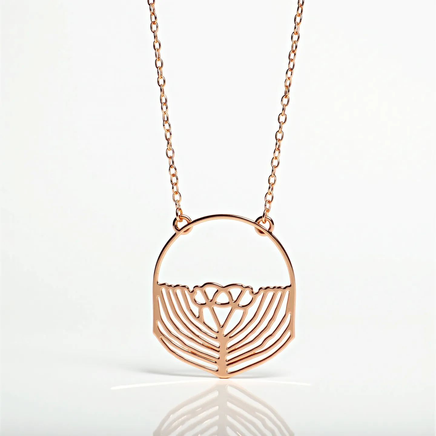 This gold circle necklace features a delicate and finely crafted openwork pendant, showcasing an intricate design that resembles a stylized botanical or organic pattern. The pendant is connected seamlessly to a slender gold chain, which complements the overall aesthetic by providing a refined and elegant appearance. The golden hue suggests that the necklace is likely made of either solid gold or gold-plated material, giving it a lustrous and polished finish. The attachment includes a simple clasp mechanism, enabling ease of wear and security. The craftsmanship highlights a minimalist style with no additional embellishments such as gems or stones, focusing on the beauty of the metalwork itself.