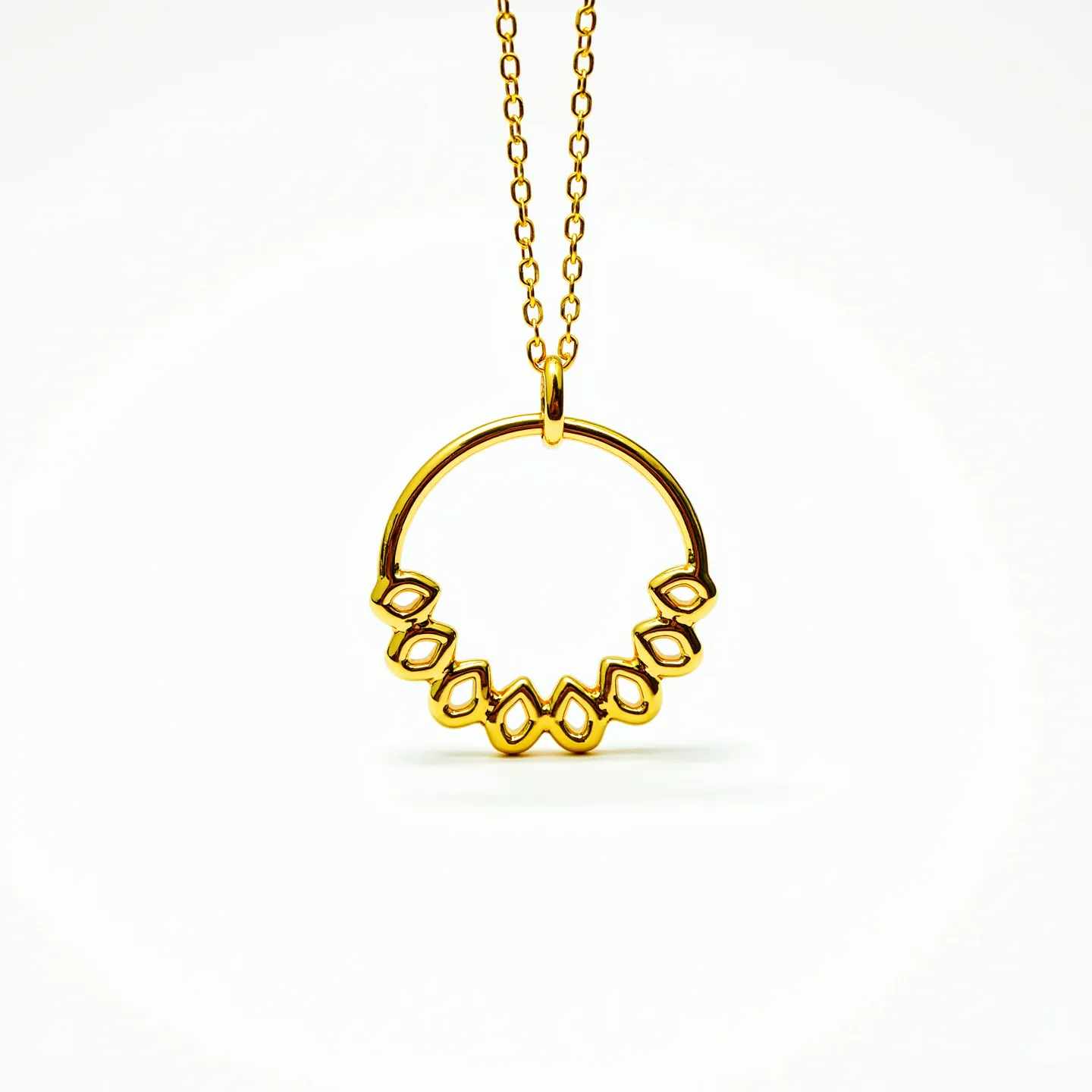 This gold circle necklace features a sleek, polished circular pendant made of gold material, adorned with a series of ornate, looped designs that suggest an intricate and elegant pattern. It is suspended from a fine gold chain, which complements the pendant beautifully. The pendant is attached to the chain via a simple, integrated bail that ensures it hangs securely. There are no visible gemstones set in this necklace, highlighting the design's focus on the crafted metalwork. The necklace showcases a delicate balance of simplicity and intricate detailing, making it a versatile and stylish accessory.