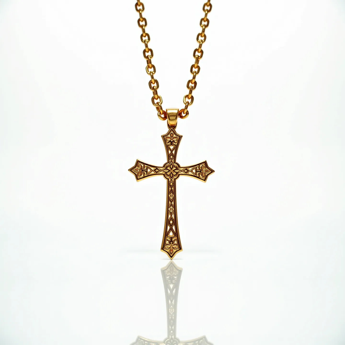 This gold cross necklace features a beautifully ornate cross pendant made of gold, showcasing intricate patterns and designs in its craftsmanship. The pendant hangs from a gold chain composed of interconnected oval links that complement the elaborate design of the cross. The clasp is a lobster claw, adding both security and ease of use when fastening. There are no visible gemstones on this piece, emphasizing the elegance of the goldwork itself. The combination of detailed ornamentation and high-quality material make this necklace a striking and sophisticated accessory.