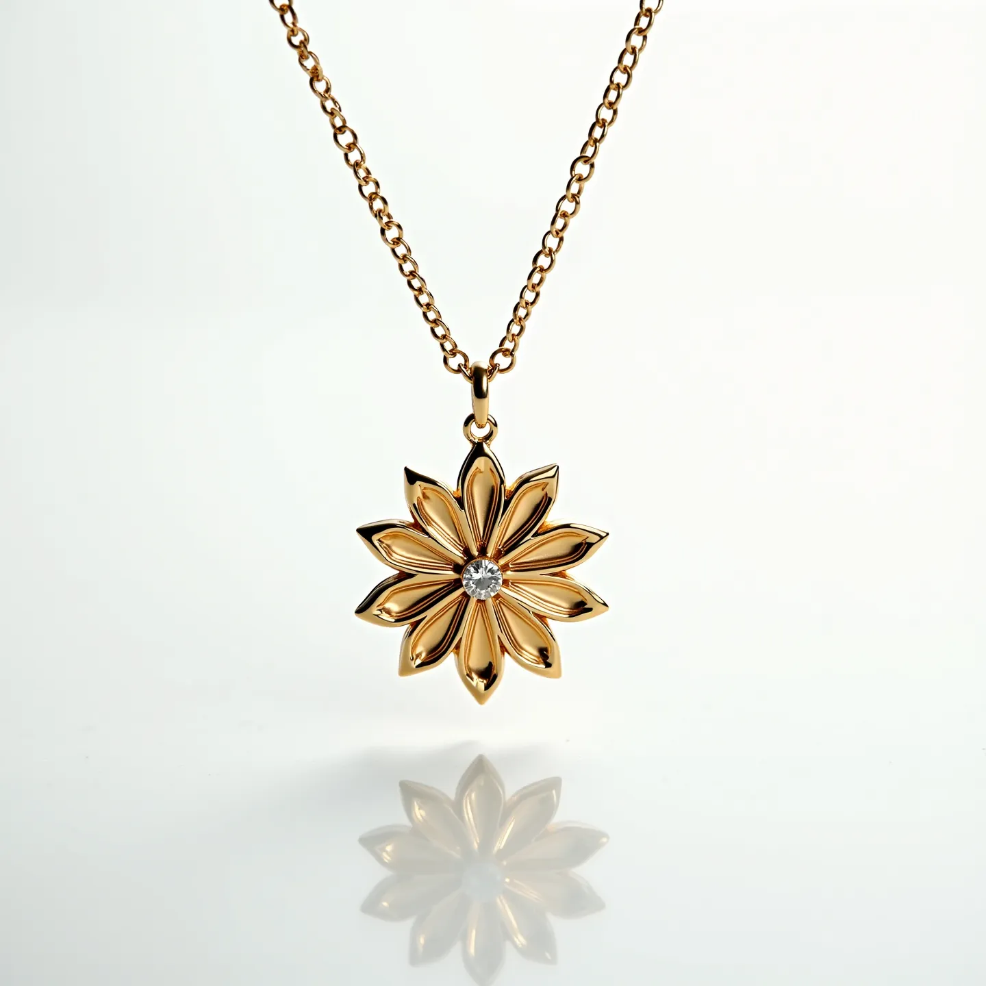 This gold flower necklace features a beautifully crafted floral pendant made of gold, with a detailed arrangement of petals radiating from the center. At the heart of the flower, there is a single, brilliant-cut diamond gem securely set, adding a touch of sparkle and elegance. The pendant is elegantly suspended from a gold chain, which appears to have a classic cable link design. A small loop connects the flower to the chain, ensuring it hangs gracefully. The necklace likely has a standard lobster clasp for secure fastening, complementing its overall sleek and refined appearance.