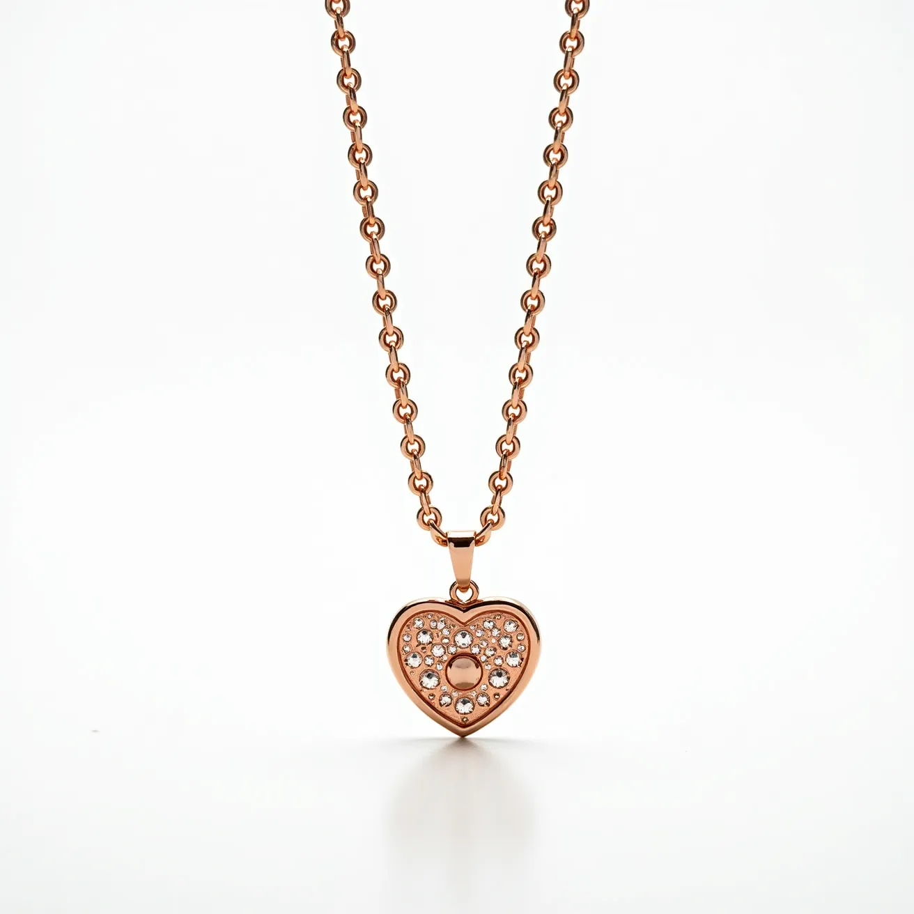 This gold heart necklace features a pendant crafted in a warm gold tone, adorned with numerous small, round-cut gems meticulously set into its surface, creating a sparkling effect. The gems are arranged symmetrically around a central circular motif, enhancing the design’s elegance. The pendant is attached to a classic gold chain with uniform links, providing a smooth and polished look. The necklace is completed with a simple bail attaching the heart to the chain, ensuring it hangs gracefully.