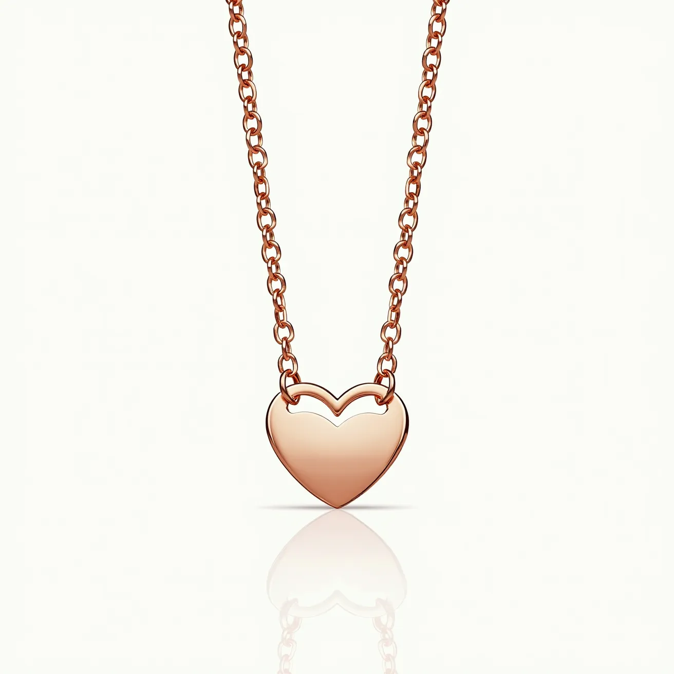 This gold heart necklace features a polished metal heart pendant, elegantly suspended from a delicate gold chain. The pendant is a smooth, seamless design without any gems or stones, highlighting the beauty of the metal itself. The chain is composed of interlocking links, ensuring flexibility and comfort. A standard clasp allows for secure fastening and easy removal, completing the elegant simplicity of the necklace.