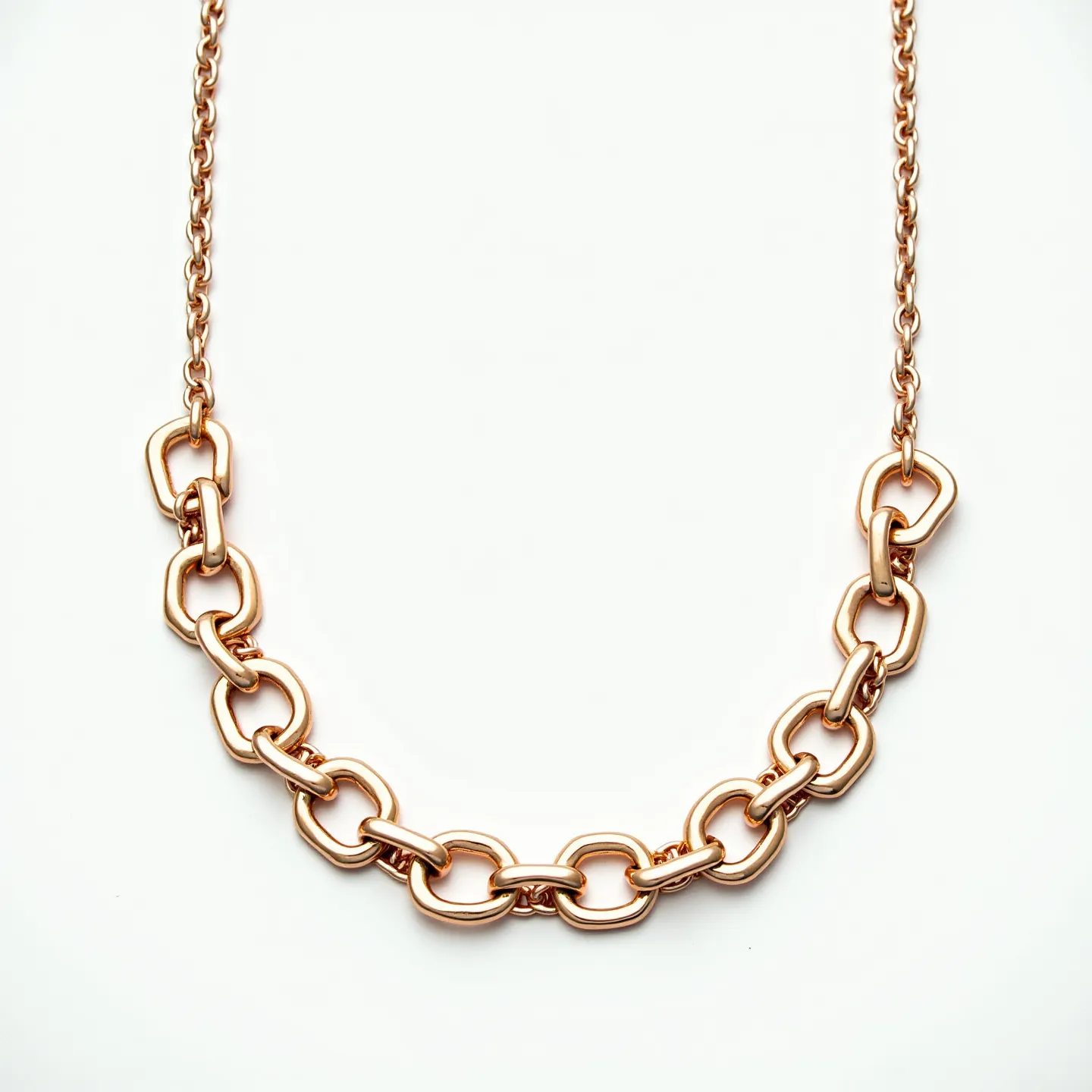 This gold link necklace features elegantly interlocking oval and rounded links made from what appears to be polished gold, giving it a luxurious and shiny appearance. The links are consistently shaped, displaying a smooth finish and a substantial texture, which add to the piece's elegance. The necklace is likely equipped with a secure clasp hidden among the links, potentially a lobster clasp, providing both functionality and style. The absence of any gemstones or elaborate settings highlights the purity and sophistication of the gold craftsmanship, making it a versatile accessory for various occasions.