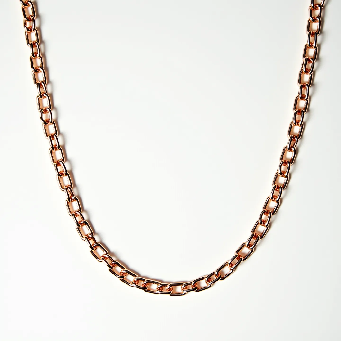 This gold link necklace features interlocking links with a lustrous finish, indicative of high-quality gold or gold plating. The uniformity and smoothness of the links suggest a polished craftsmanship, ensuring a comfortable wear. There are no visible gemstones, emphasizing the simplicity and elegance of the metalwork. The necklace likely includes a traditional clasp, such as a lobster clasp or spring ring, to ensure secure fastening. The overall design highlights the timeless appeal of a classic gold chain necklace, perfect for both casual and formal settings.