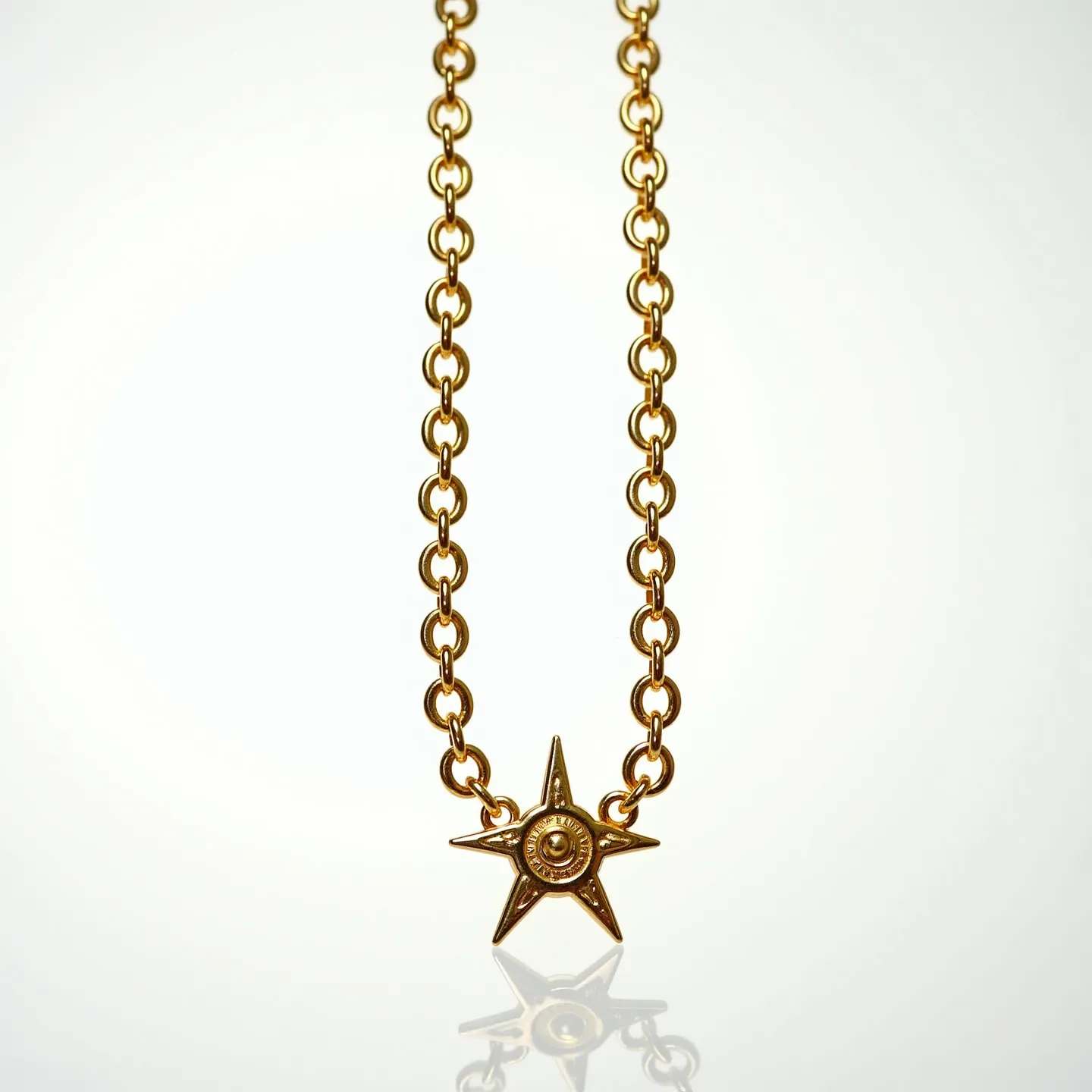 This gold link necklace features a series of evenly spaced circular links, crafted from a material with a rich golden hue, likely gold or gold-plated metal. The centerpiece is a star-shaped charm, offering a striking design with a smooth, polished finish. At the center of the star, there appears to be a small, spherical embellishment, which could potentially be a gem or a decorative metal bead. The necklace likely has a clasp or attachment mechanism typical of link necklaces, although the specific type (e.g., lobster clasp, spring ring) isn't visible in this view. The combination of the gold links and star charm creates an elegant and stylish piece of jewelry.