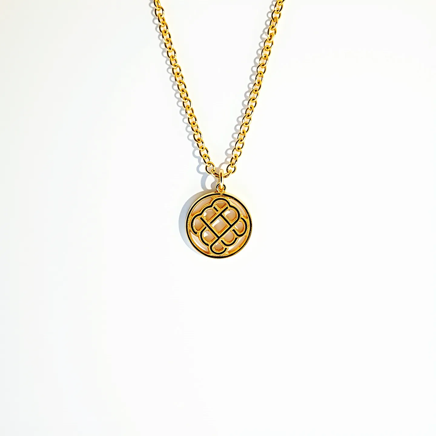 This gold medallion necklace features a circular pendant with an intricate cutout design, hanging from a gold chain composed of interlinked oval links. The medallion appears to be crafted entirely from gold, exuding a smooth and polished finish. The chain's links have a uniform size and are arranged with a repetitive, symmetrical pattern, providing both elegance and strength. The pendant is securely attached to the chain via a simple loop attachment, which allows it to move freely while maintaining its prominent position. The clasp is a standard spring ring, ensuring a secure fit while being easy to open and close.