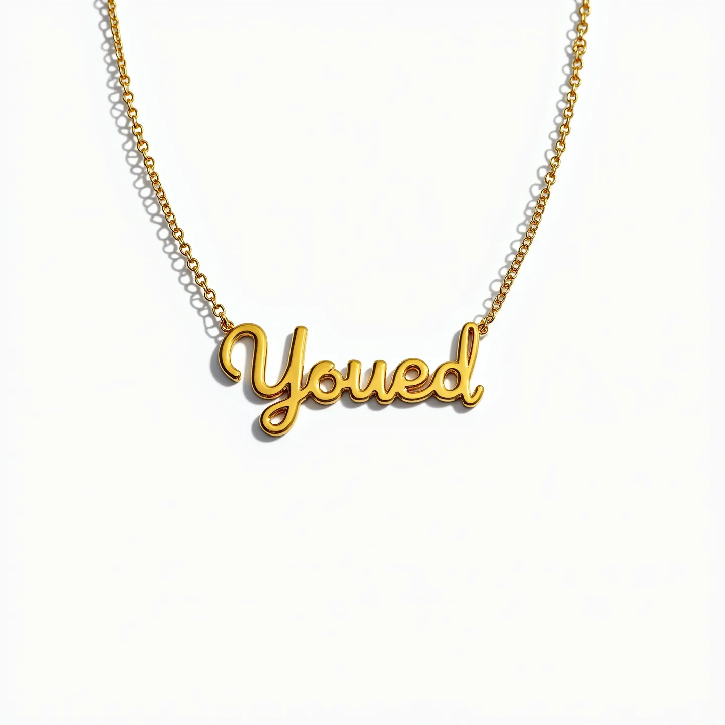 This gold name necklace features the name “Youed” in a flowing, cursive style crafted from polished gold. The nameplate is attached to a delicate gold chain that complements the warm hue and luster of the name, reflecting a classic elegance. The necklace is designed with a simple yet secure clasp that ensures ease of wear and removal. This piece is devoid of additional embellishments such as gems or stones, highlighting the purity and sleekness of its gold craftsmanship.