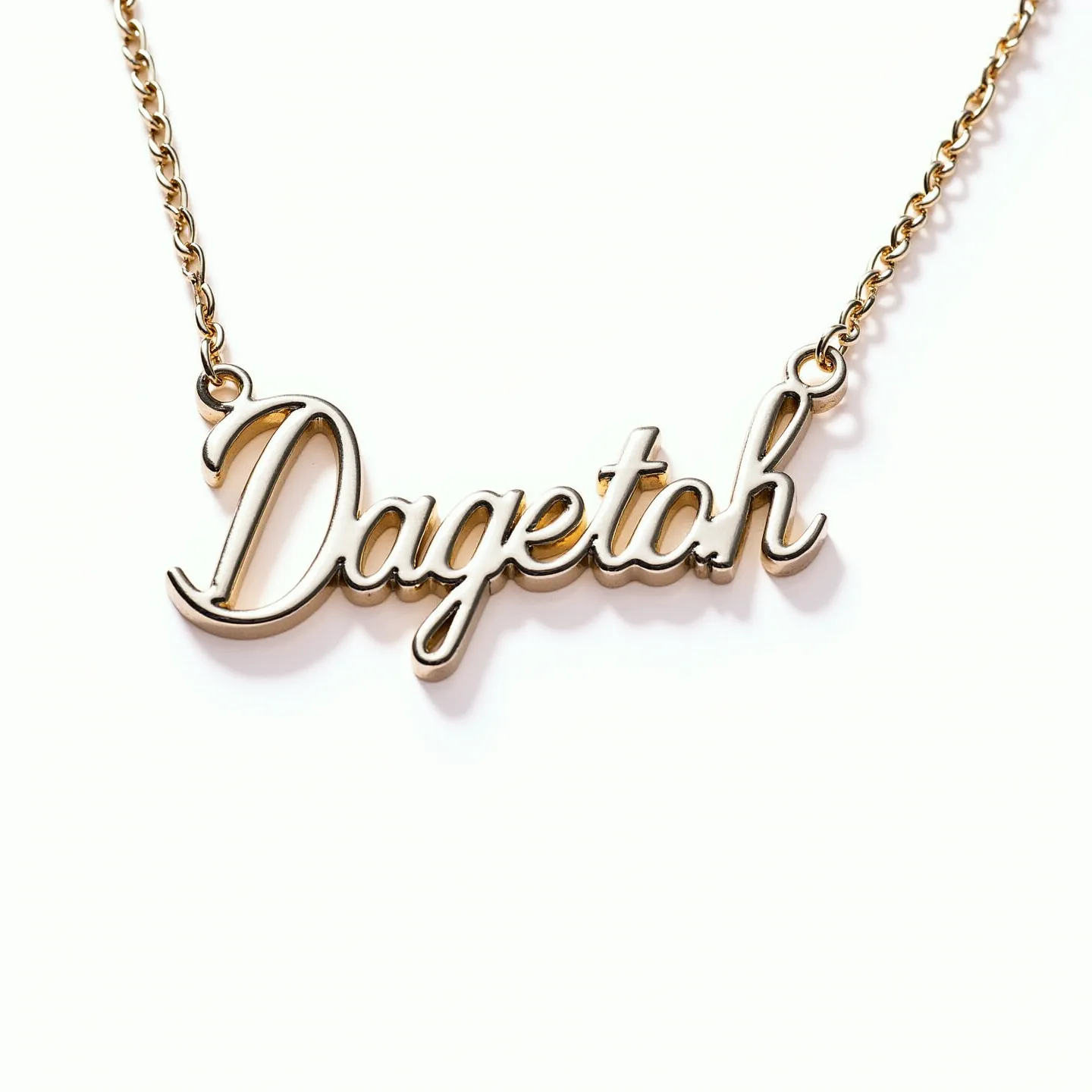 This gold name necklace features a script-style nameplate that reads "Dageto h." The material appears to be polished gold, giving it a shiny and elegant finish. The nameplate is integrated into a delicate chain, which is likely made of the same gold material, maintaining consistency throughout the piece. The attachment of the nameplate to the chain is secured through loops on either end of the name, ensuring stability and smooth movement. No additional gems or stones are present, focusing the attention solely on the elegance of the gold and the personalization of the nameplate. The necklace is likely fastened with a simple clasp, which is commonly used in jewelry of this style for ease and security.