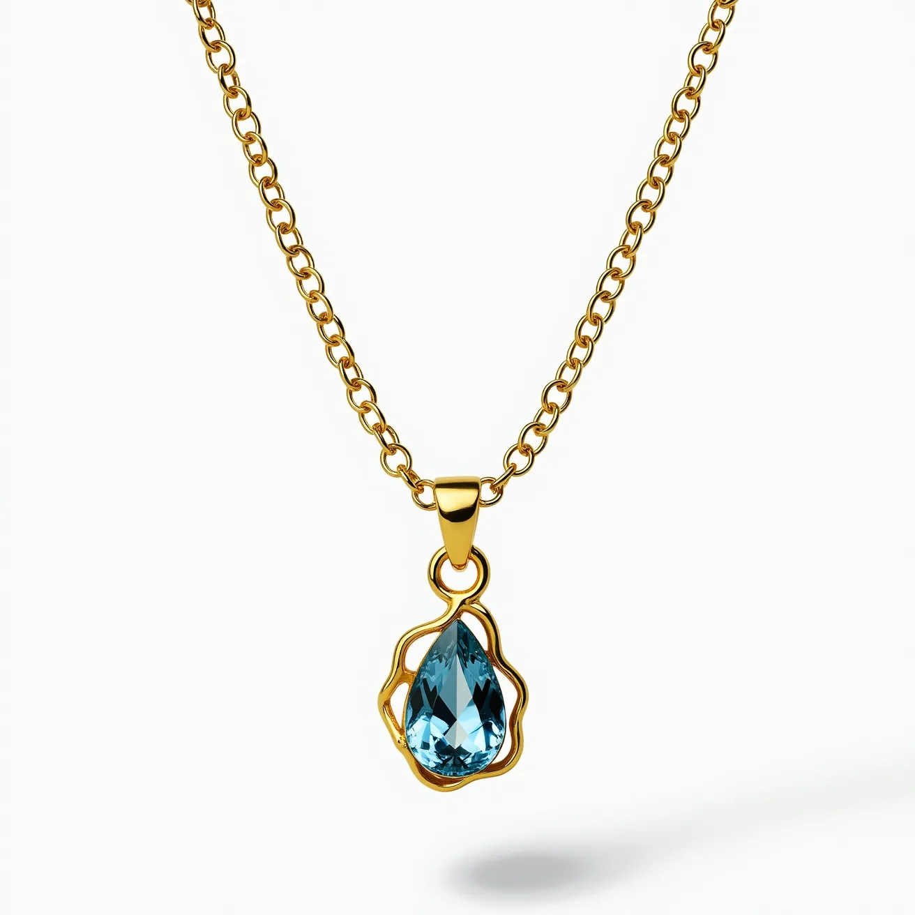 This gold necklace features a delicate chain with interlocking links, crafted from high-quality gold that offers an elegant and timeless appearance. The centerpiece of the necklace is a striking blue gemstone, meticulously cut into a pear shape that enhances its reflective qualities. The gem is secured in a bezel setting, offering a seamless and modern look while ensuring the stone's stability. The pendant is attached to the chain with a graceful gold loop that complements the overall design.