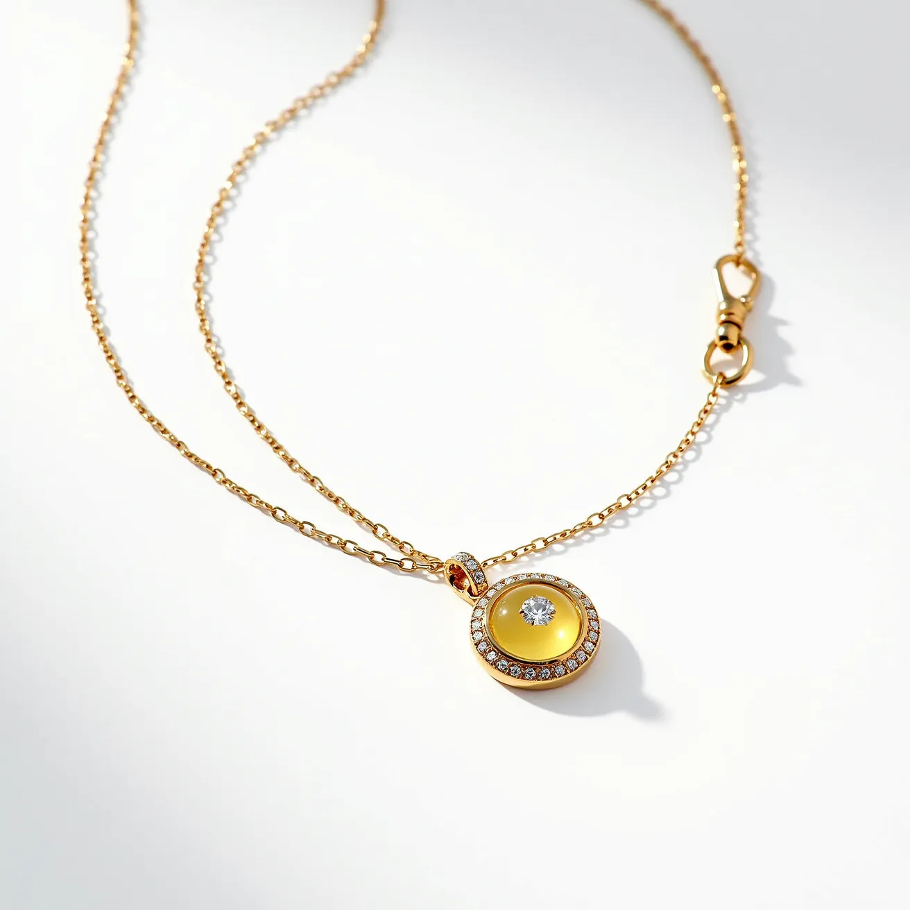 This gold necklace features a delicate chain and a round pendant. The pendant is adorned with a central, round-cut gemstone that appears clear and is possibly a diamond, set within a bezel that enhances its brilliance. Surrounding the central stone is a circle of smaller pavé-set stones, adding a touch of elegance and sparkle. The necklace includes a lobster clasp, ensuring a secure attachment. The refined craftsmanship and the combination of materials create a luxurious and sophisticated piece.