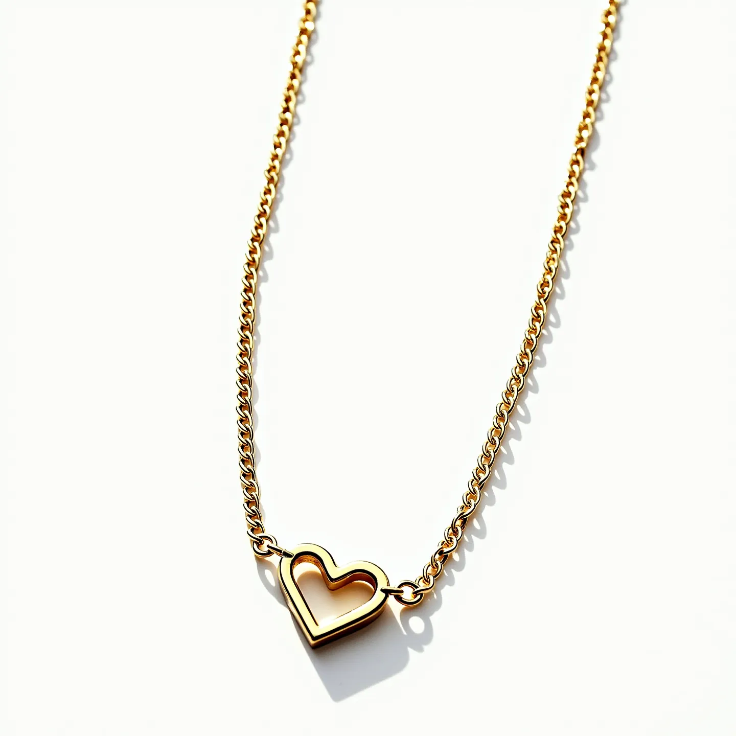 This heart chain necklace features a delicate and elegant design, crafted from a shiny gold-colored metal. The centerpiece is a heart-shaped pendant, which is a hollow, open design adding a modern and airy feel to the necklace. The heart is seamlessly integrated into a matching chain that boasts fine links, offering a harmonious continuation of the gold theme. The necklace is completed with a clasp attachment, which is likely a lobster or spring ring clasp, providing secure and easy wearability. The overall simplicity and sophistication of the necklace make it a versatile accessory suitable for various occasions.