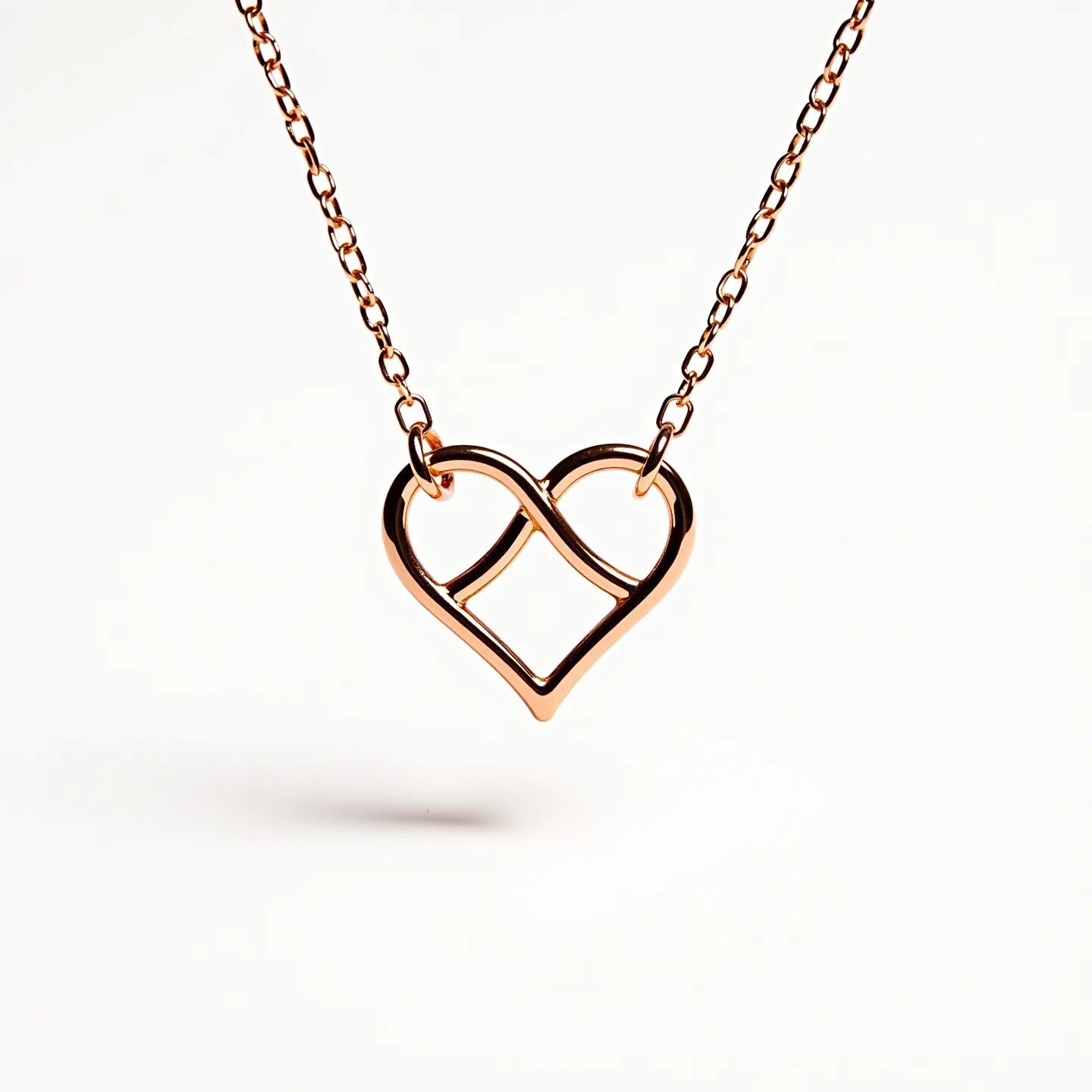 This infinity heart necklace features a sleek and elegant design, crafted from a lustrous rose gold metal that gives it a warm and inviting appearance. The pendant combines the timeless symbols of infinity and a heart, seamlessly intertwined to create a modern and meaningful piece. The chain is composed of delicate links, complementing the pendant's design while providing durability and comfort. The necklace is likely fastened with a standard clasp, ensuring security and ease of wear. This charming piece makes a beautiful accessory for both daily wear and special occasions.