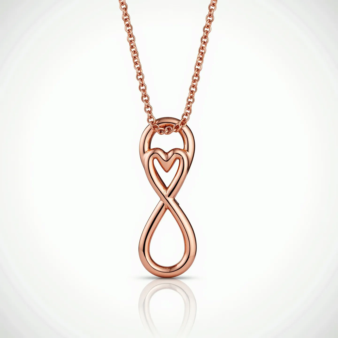 This infinity heart necklace features a graceful interweaving of a heart and infinity symbol, crafted from rose gold metal that exudes warmth and elegance. The pendant is suspended from a rose gold chain, enhancing the cohesive design with subtle sophistication. The necklace does not incorporate any gemstones or intricate settings, drawing focus to its smooth, polished finish and meaningful symbolism. The chain likely features a standard clasp, typical for such necklaces, ensuring secure and comfortable wear. The overall design of this piece embodies a timeless expression of love and eternity.