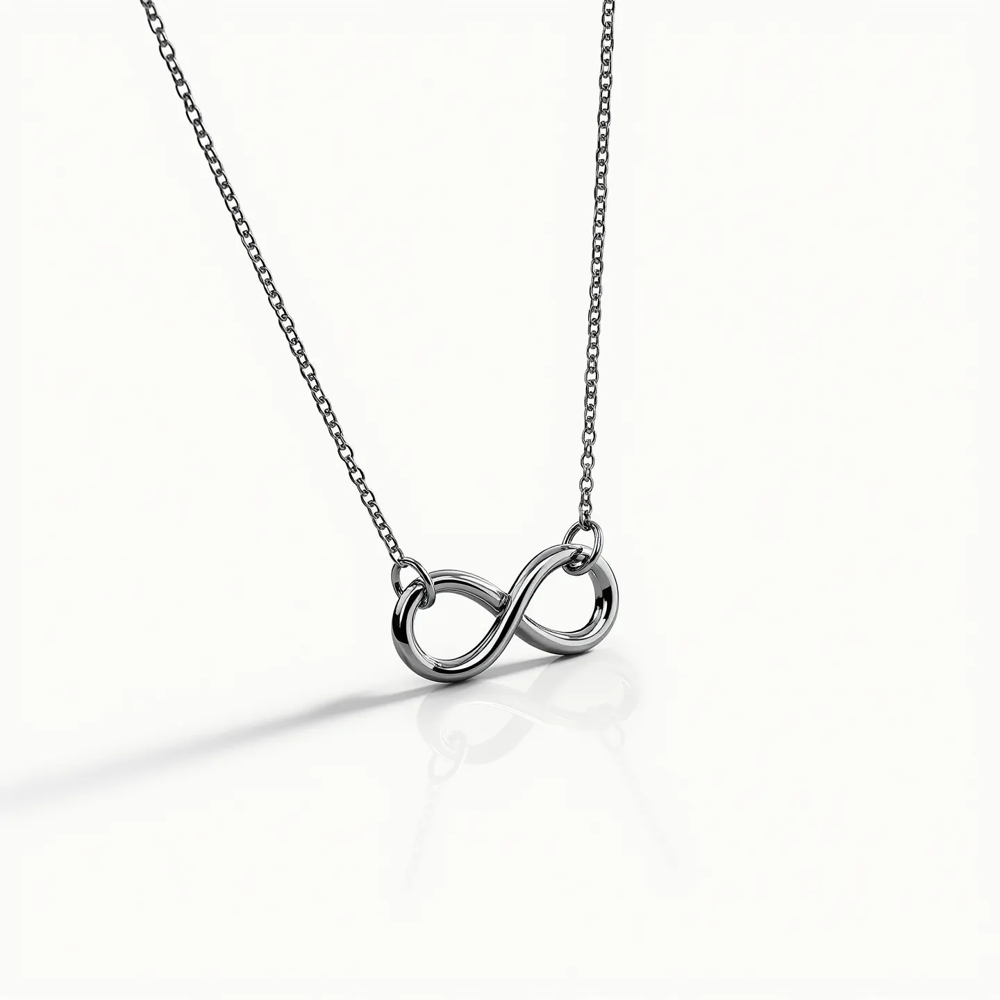 This infinity necklace features a sleek, polished metal infinity symbol as its central pendant, exuding elegance and simplicity. The pendant is likely crafted from stainless steel or silver, offering a smooth, reflective surface that enhances its modern aesthetic. The necklace includes a delicate chain that complements the pendant, likely made from the same material to ensure consistency and durability. Each end of the infinity pendant seamlessly transitions into the chain, ensuring a secure attachment that maintains the necklace’s streamlined appearance. While the photo does not reveal specific details about clasps or additional embellishments, the overall design suggests a contemporary style suited for everyday wear.