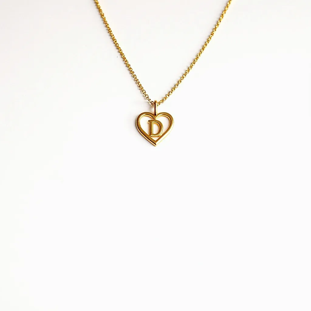 This initial charm necklace features a delicate gold chain with a heart-shaped charm at its center. The charm is crafted in the same gold-tone material, enclosing the letter "D" within its design. There are no gemstones or intricate settings present, keeping the overall aesthetic simple and elegant. The necklace is completed with a classic clasp to ensure secure wear, complementing its minimalist and personalized style.